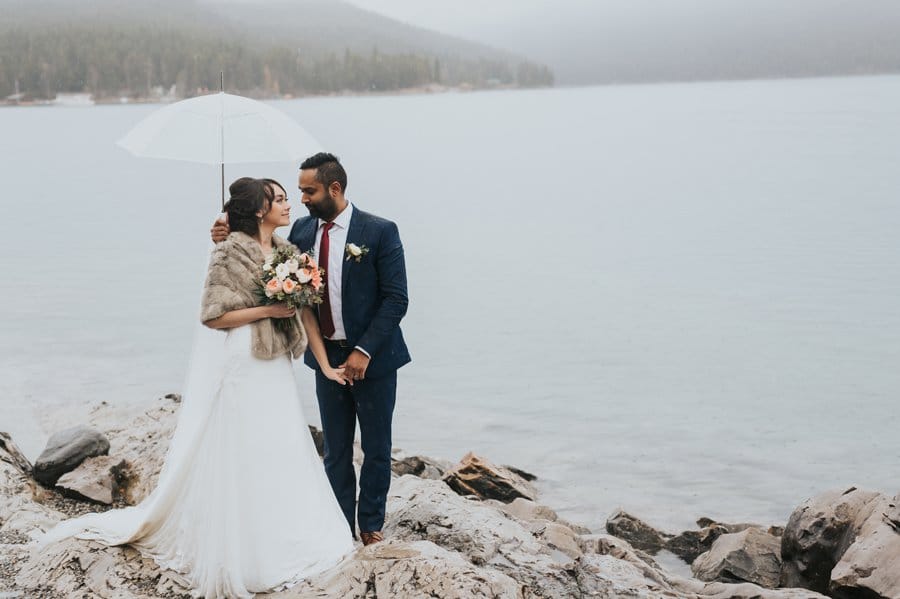Lake Minnewanka bride & groom portraits in the rain autumn mountain wedding