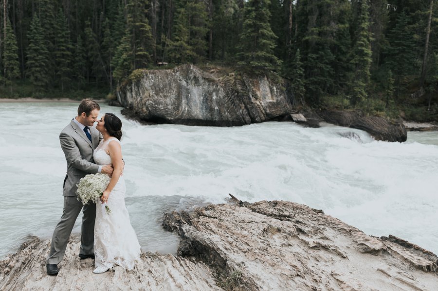 bride & groom wedding photos at the natural bridge in Yoho National park