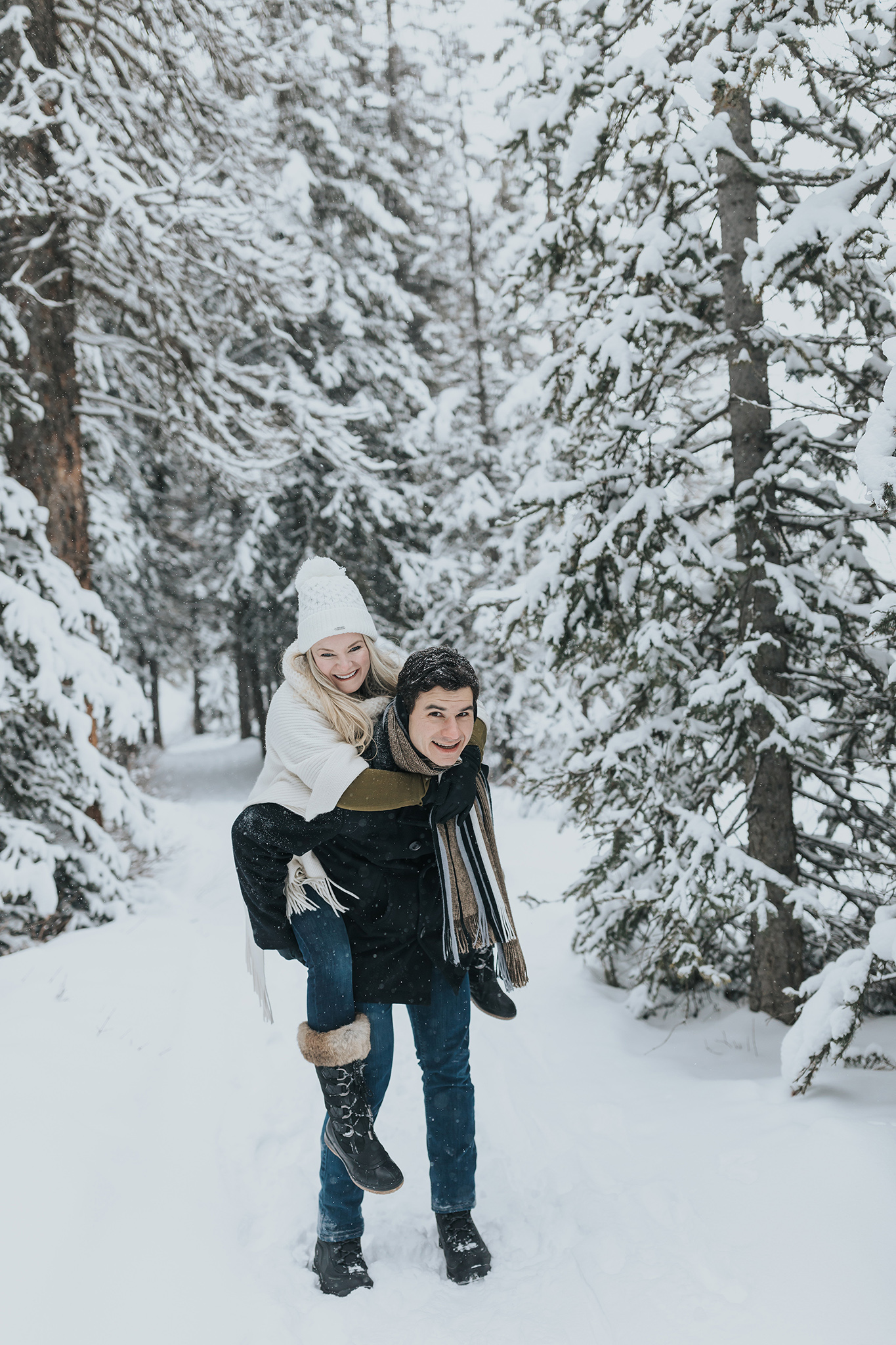 playful Lake Louise winter couples anniversary photos in the Canadian Rocky Mountains