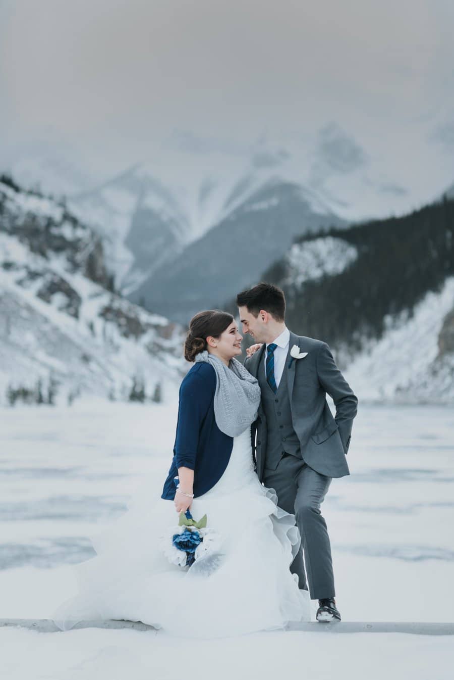 Canmore wedding photographers portraits mountains winter bride groom