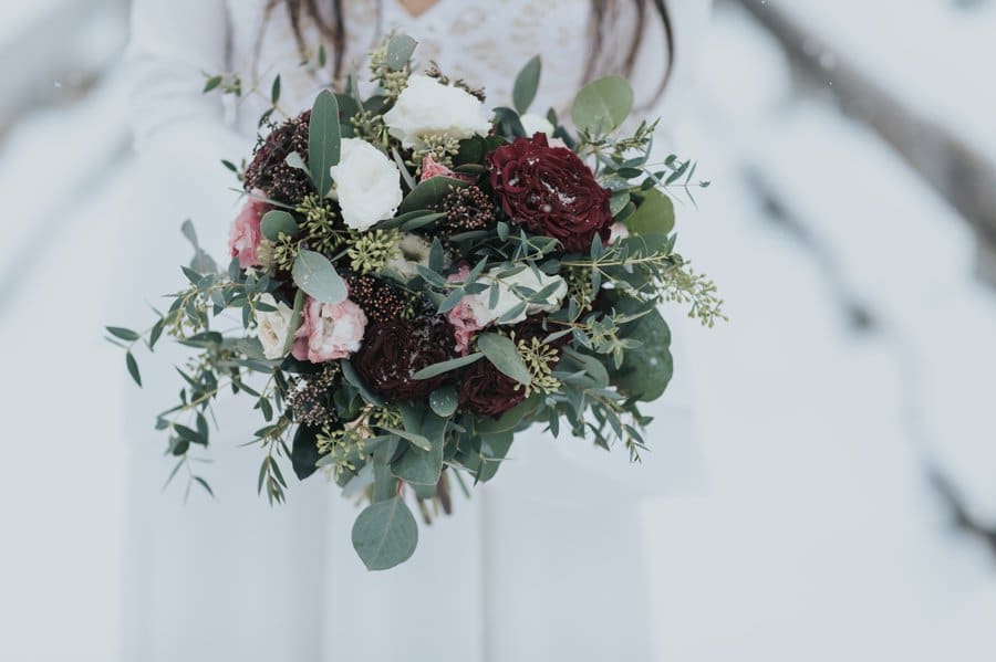 Snowy mountain wedding in the Canadian Rockies moody bouquet