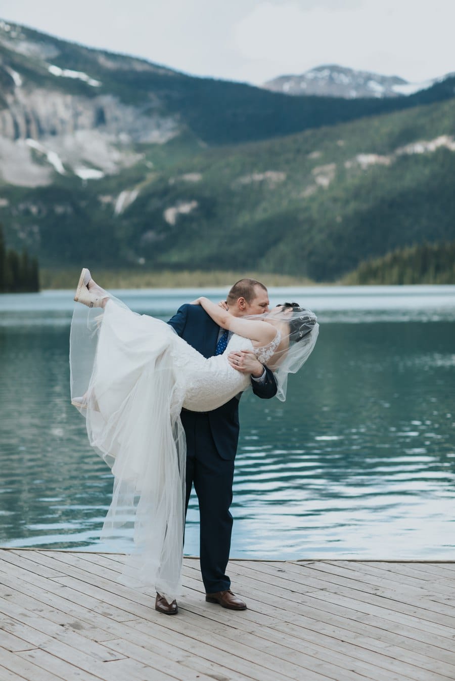 emerald lake lodge intimate wedding bride groom on dock