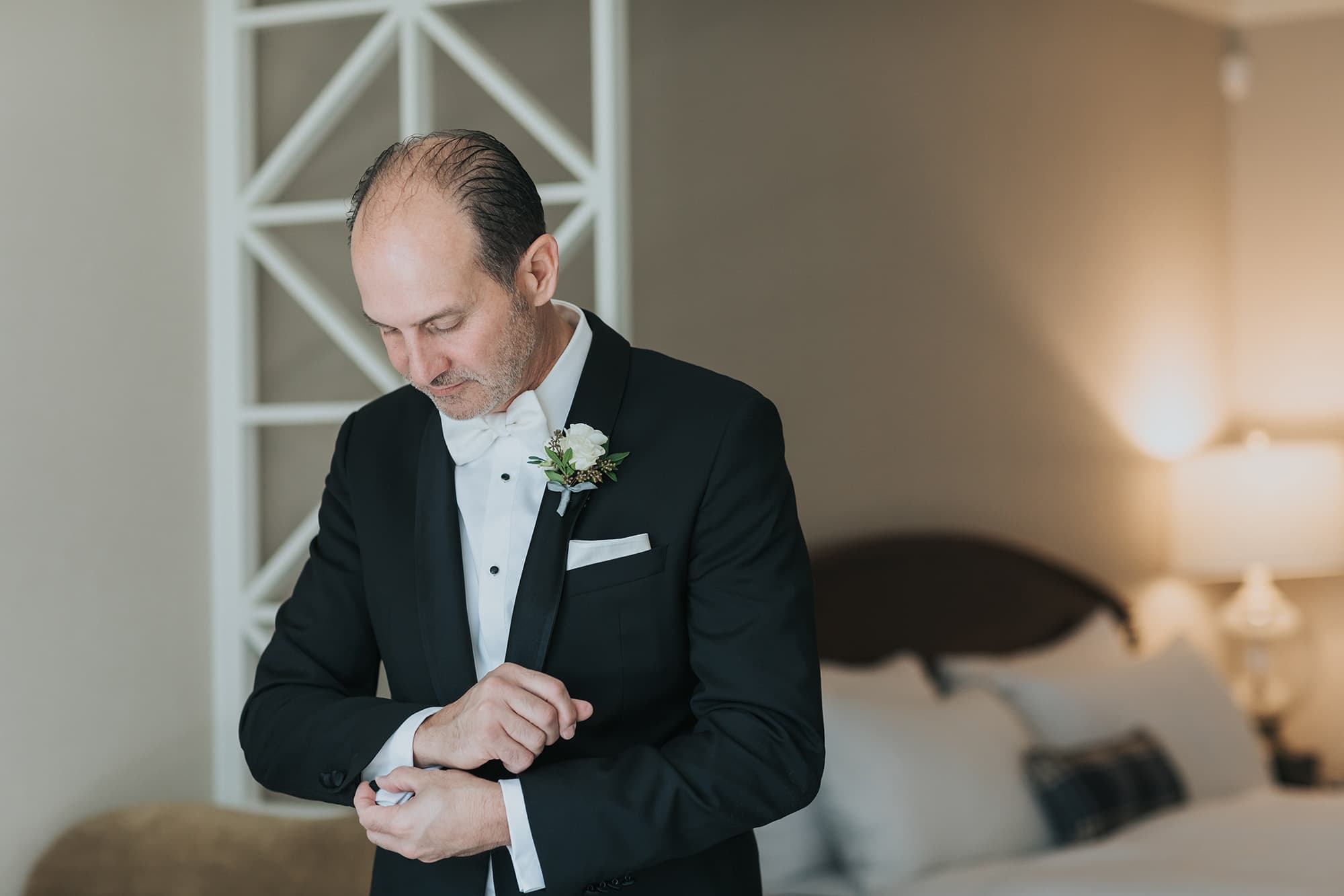 Elegant Fairmont Chateau Lake Louise wedding groom getting ready