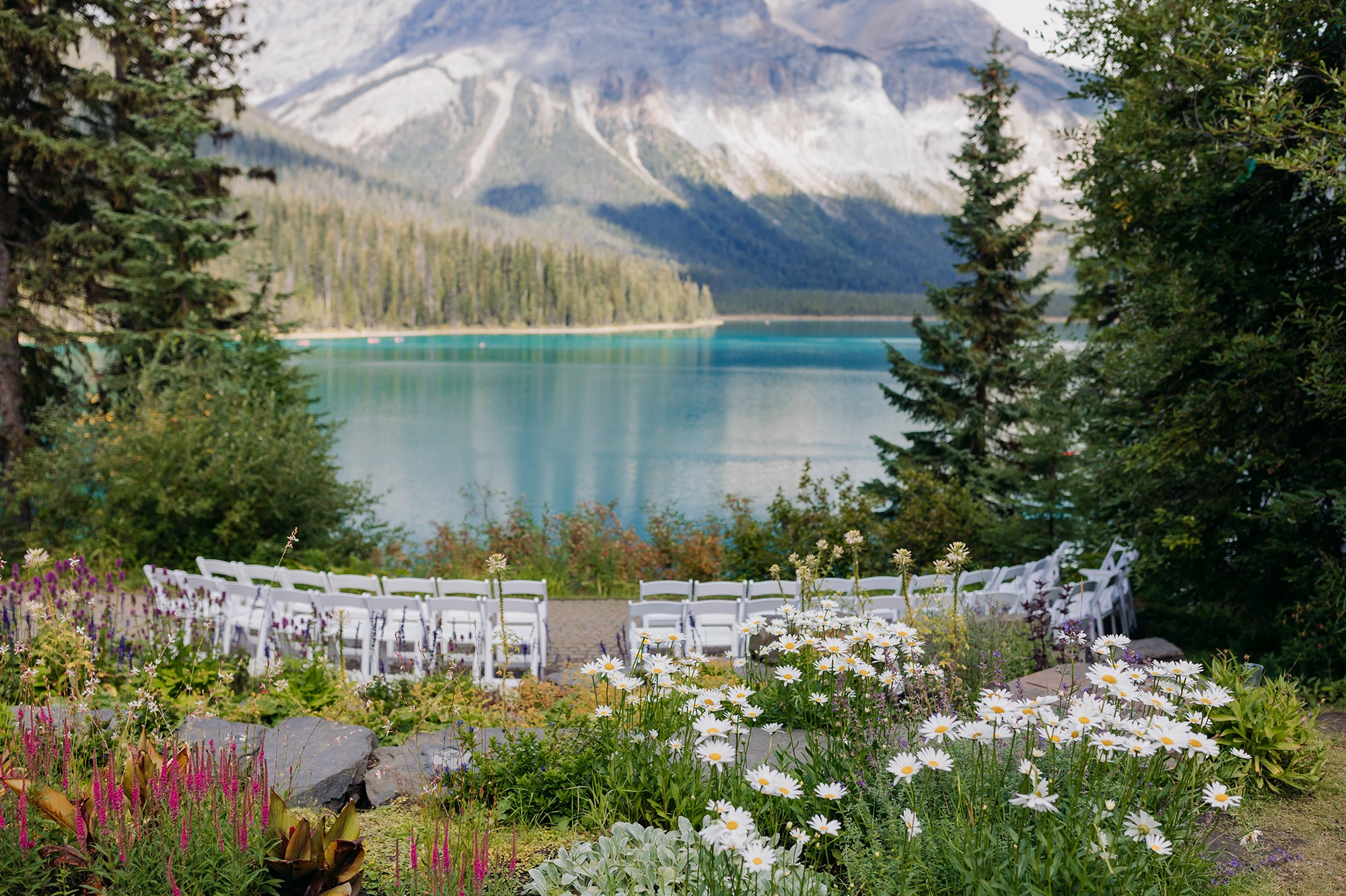 emerald lake autumn wedding outdoor ceremony at viewpoint with mountain views and blue green waters