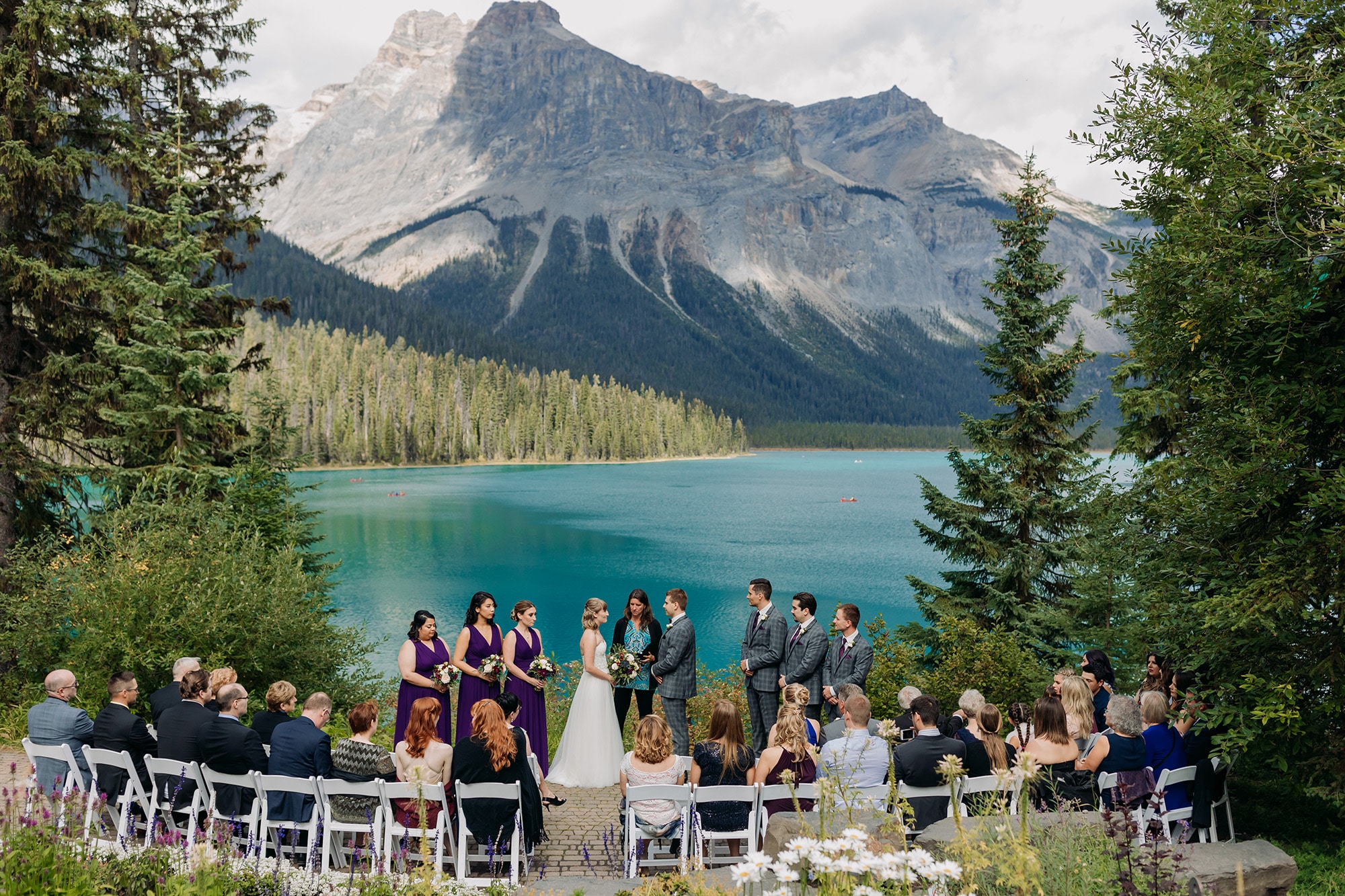 emerald lake autumn wedding outdoor ceremony at viewpoint with mountain views and blue green waters