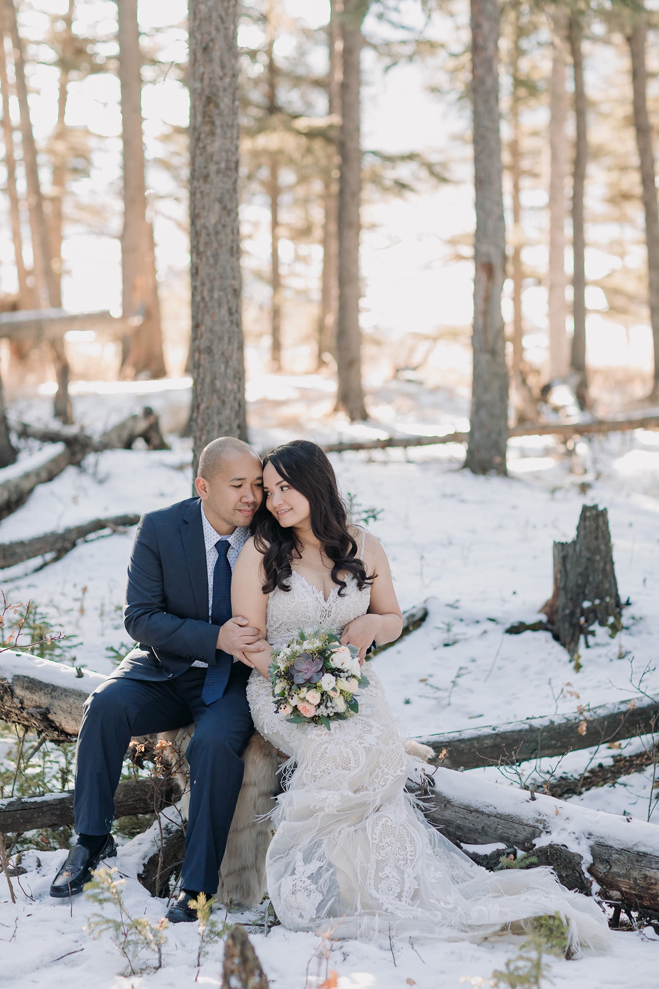 intimate wedding portraits in the forest snowy woodland photos