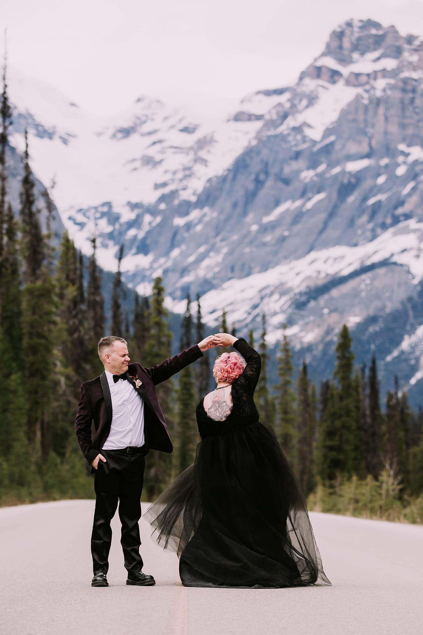 dark wedding inspiration in the mountains tattoed bride in black wedding dress