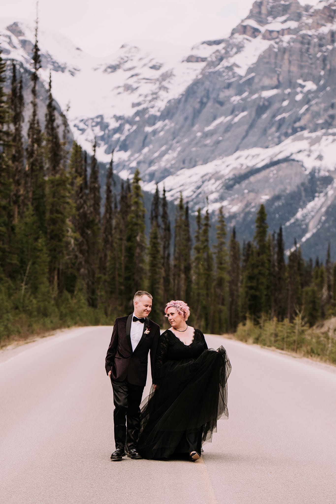 dark wedding inspiration in the mountains bride in black wedding ballgown