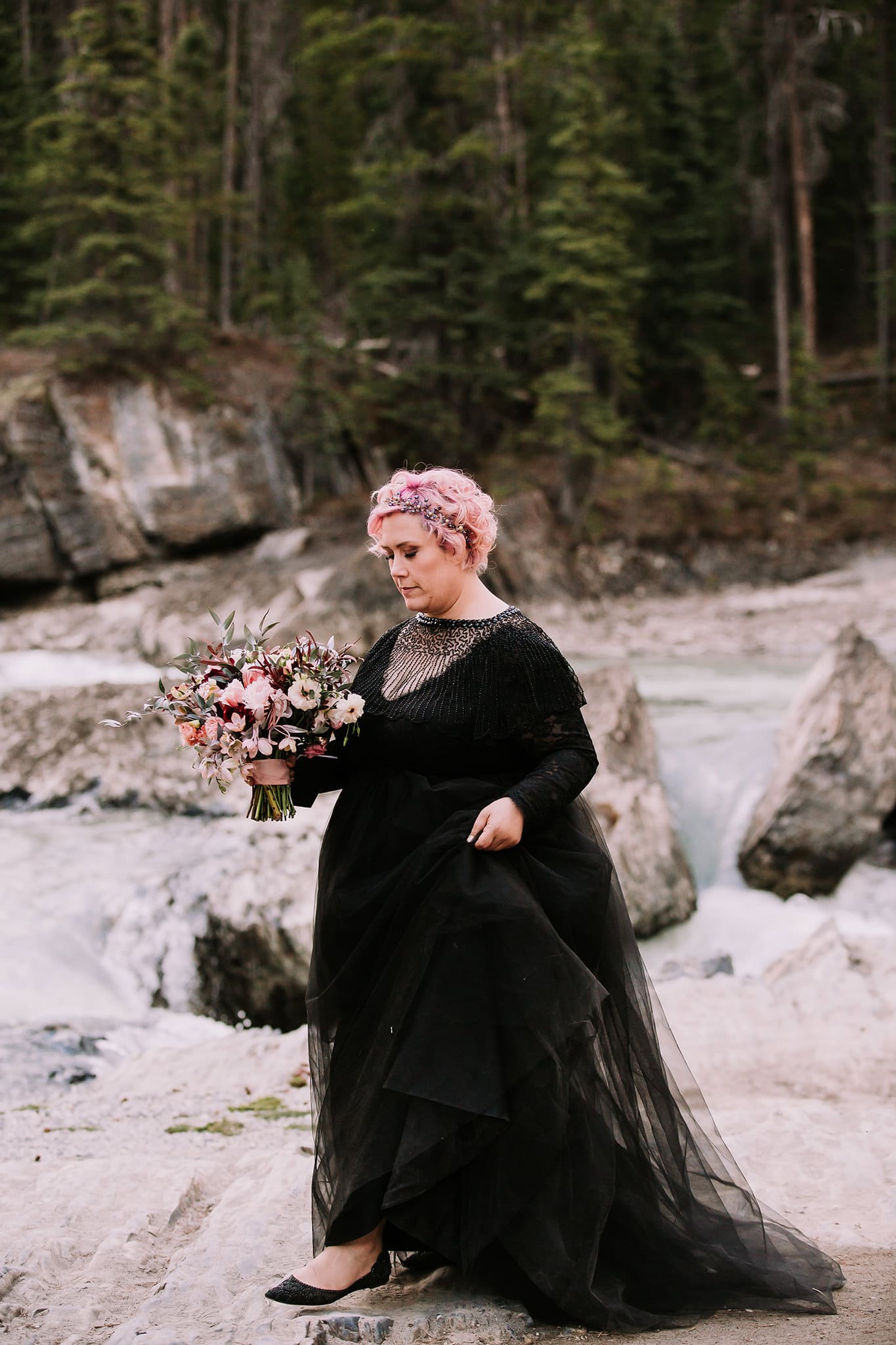 dream mountain vow renewal natural bridge yoho national park bride in black wedding gown walking to cermeony