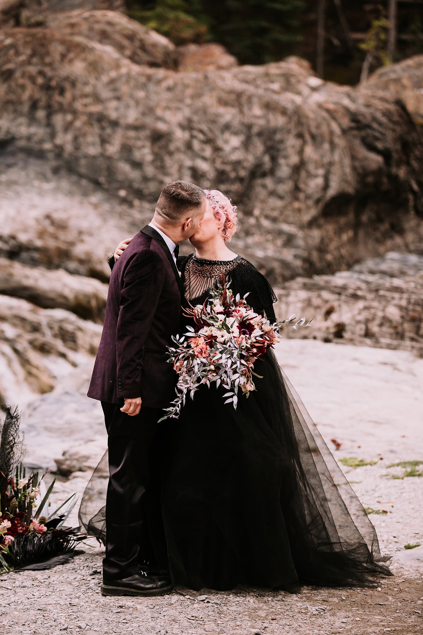 dream mountain vow renewal natural bridge yoho national park bride in black wedding gown first kiss