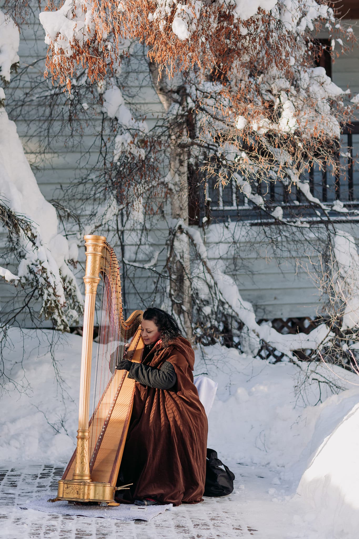 harpist playing ceremony at viewpoint emerald lake lodge winter wedding