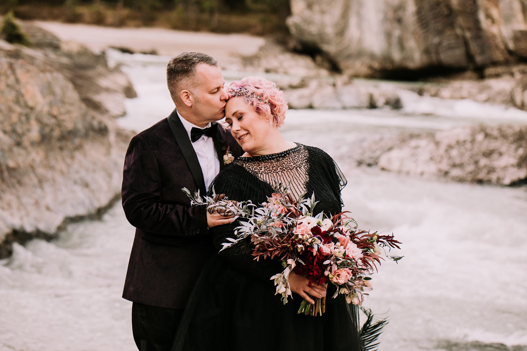 dark wedding vow renewal at natural bridge with bride in black wedding dress pink hair alternative wedding