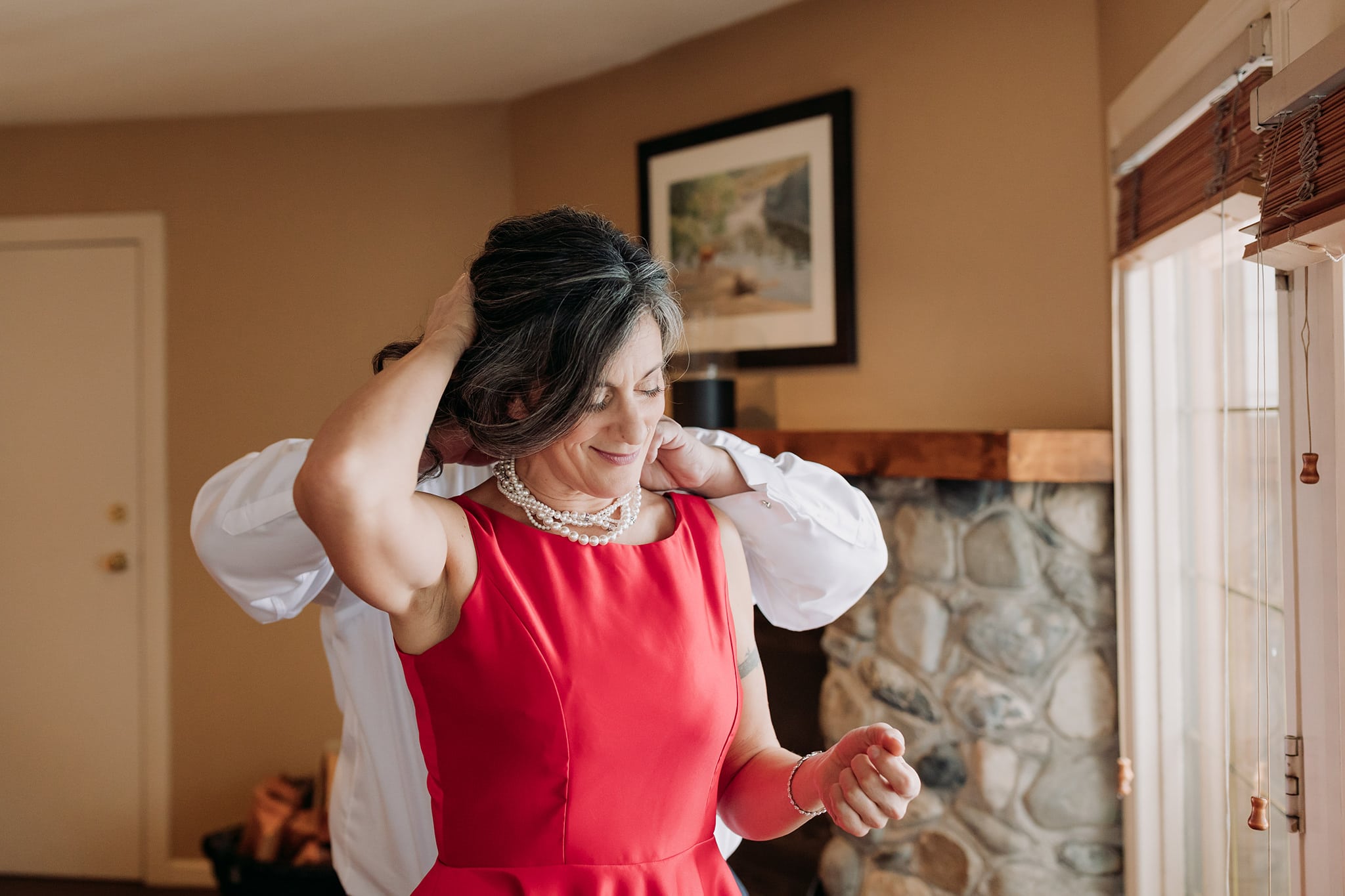 bride groom getting ready together in cabin at emerald lake lodge before their elopement ceremony