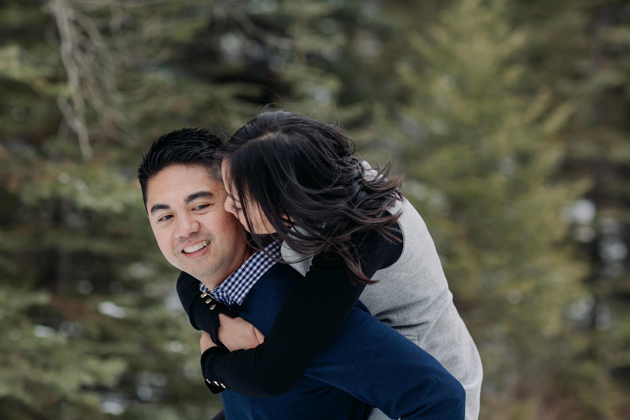 Banff National Park early winter November engagement session on a windy day at Tunnel Mountain piggyback