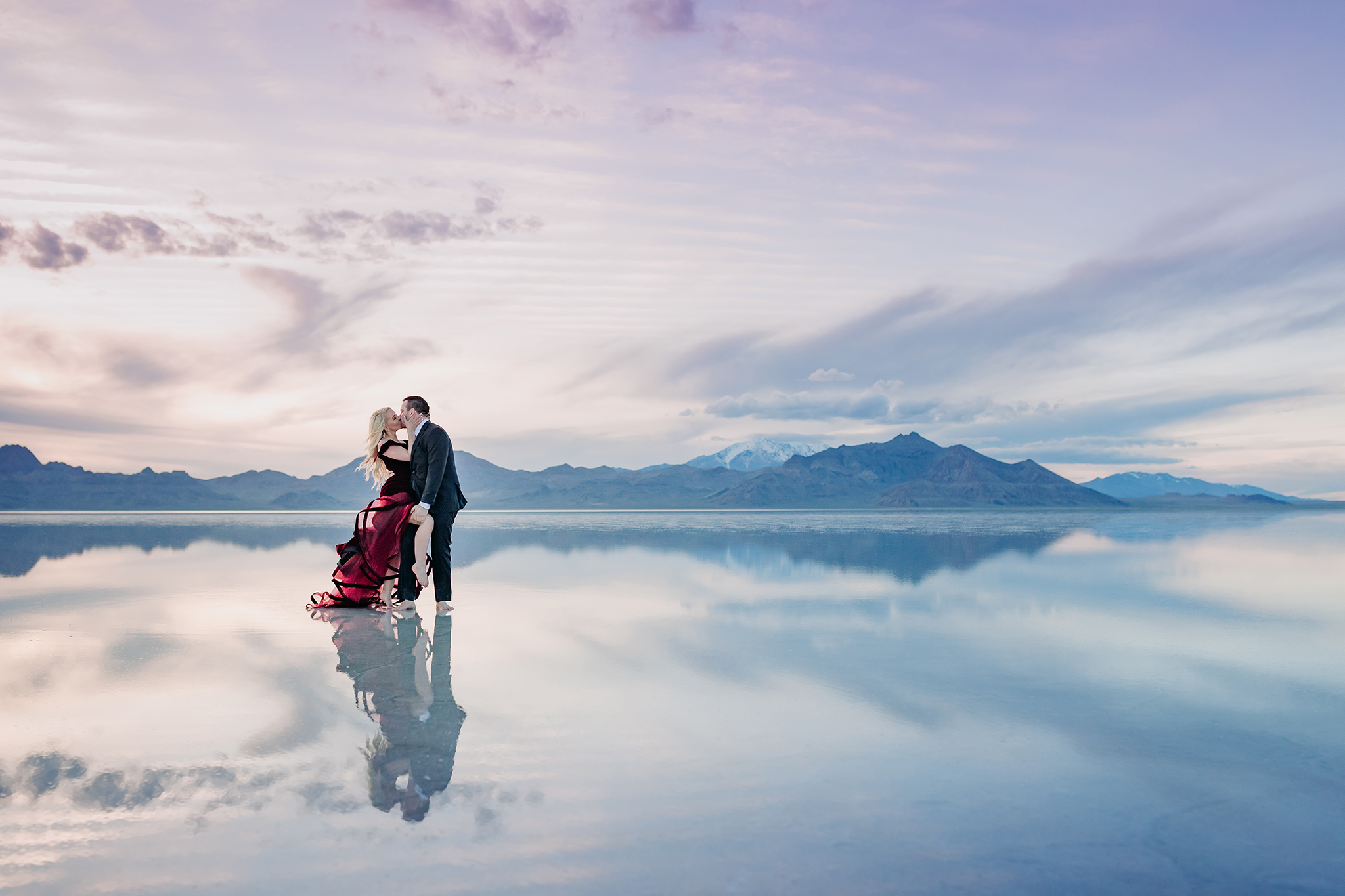 dancing in the water mirror reflections mountain views at sunset in Utah Bonneville Salt Flats