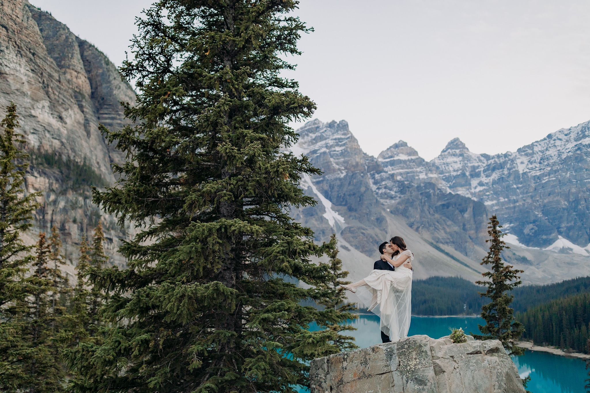 A Guide to Eloping in the Canadian Rockies | Mountain Wedding photographed by ENV Photography | Art Deco Moraine Lake elopement in early September