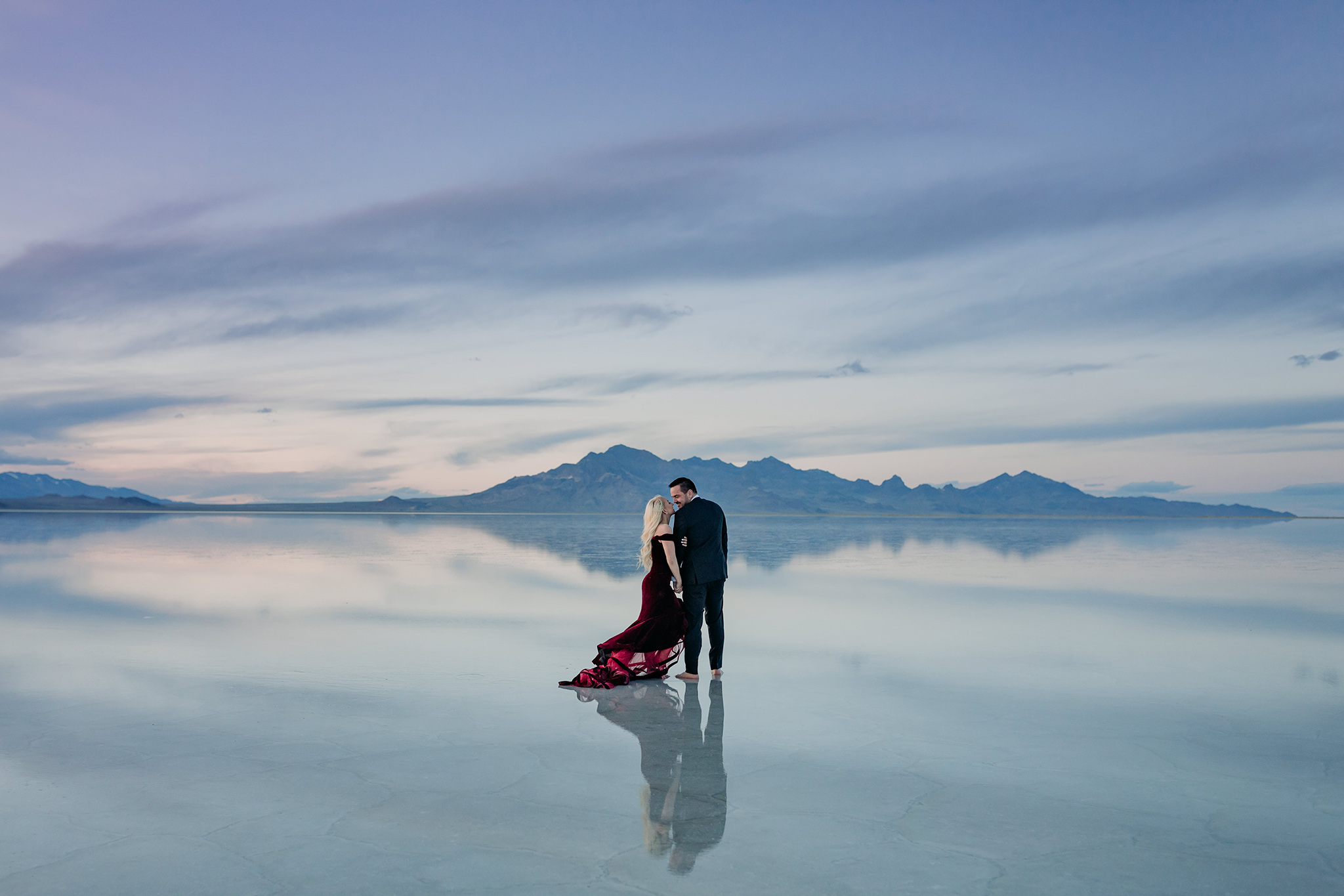 Bonneville Salt Flats flooded at Sunset for epic couples engagement session by ENV Photography