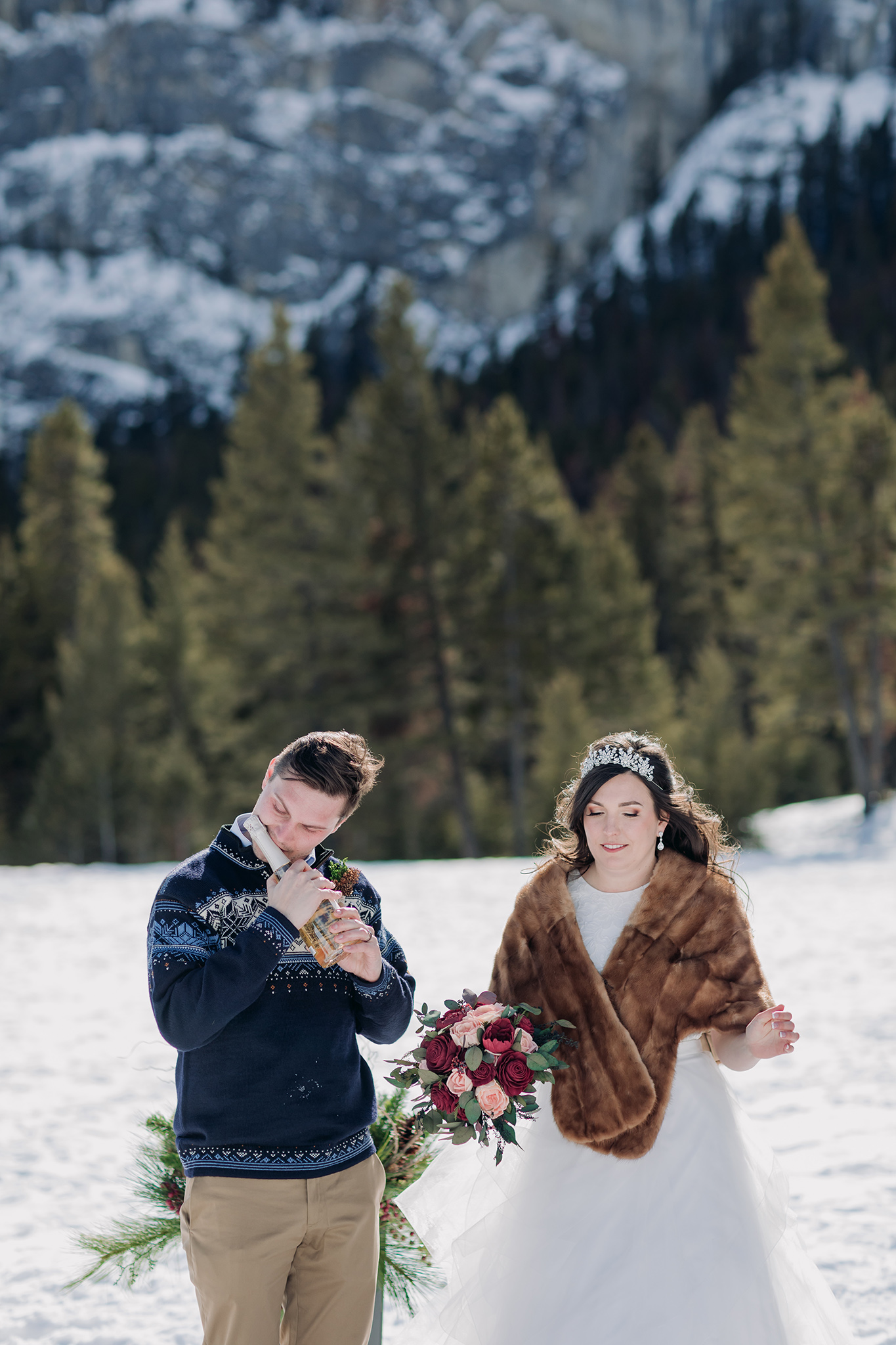Tunnel Mountain winter wedding ceremony in Banff National Park photographed by ENV Photography champagne