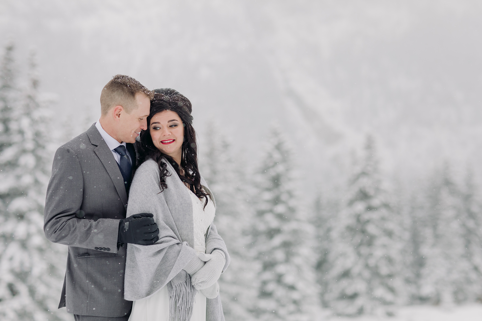 Cascade Ponds winter wedding portraits in a snow storm in Banff National Park in the Canadian Rocky Mountains photographed by ENV Photography