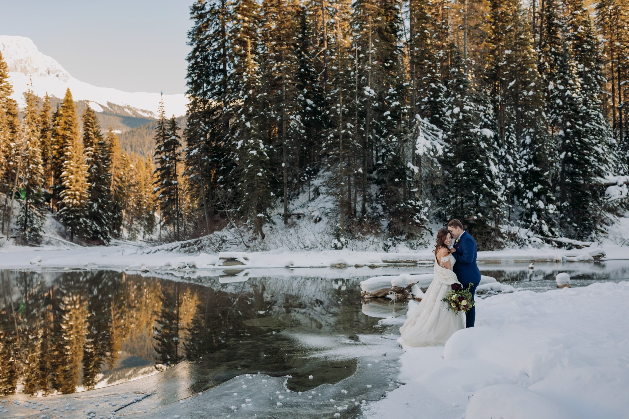A Guide to Eloping in the Canadian Rockies | Mountain Wedding photographed by ENV Photography | bride & groom at Emerald Lake Lodge for their winter destination wedding in the mountains