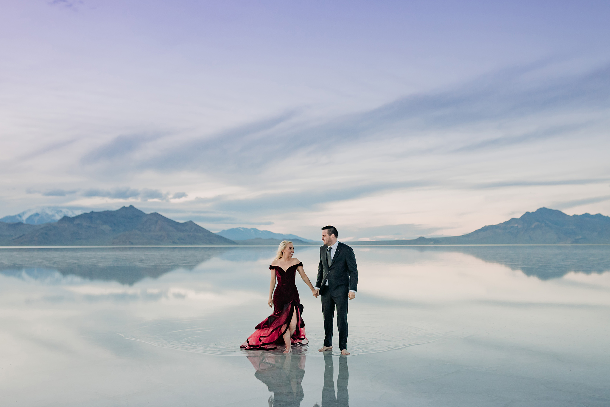 Bonneville Salt Flats flooded at sunset with mirror reflections mountains in the distance. Utah Engagement Photos