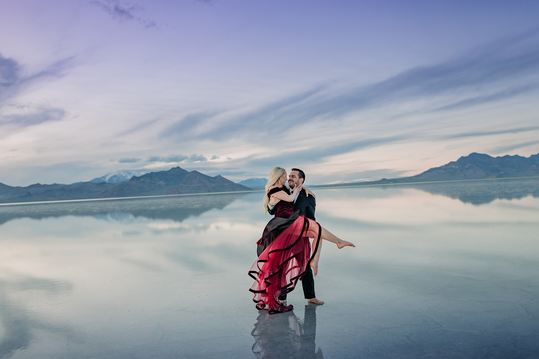 Bonneville Salt Flats flooded at Sunset for epic couples engagement session by ENV Photography swept off her feet