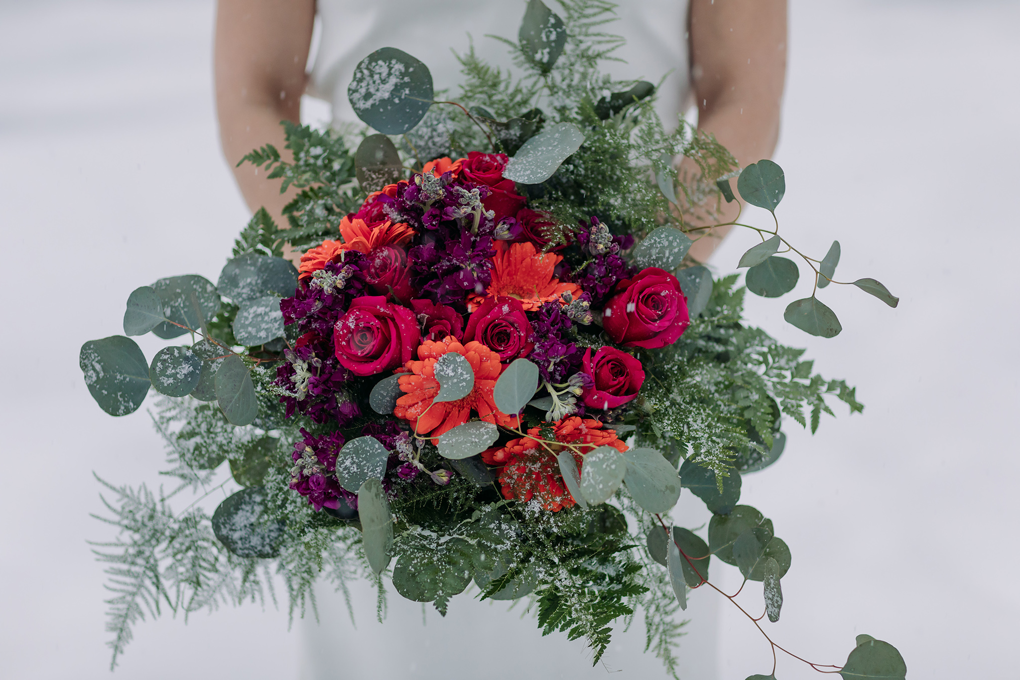 bright colorful moody winter wedding bouquet