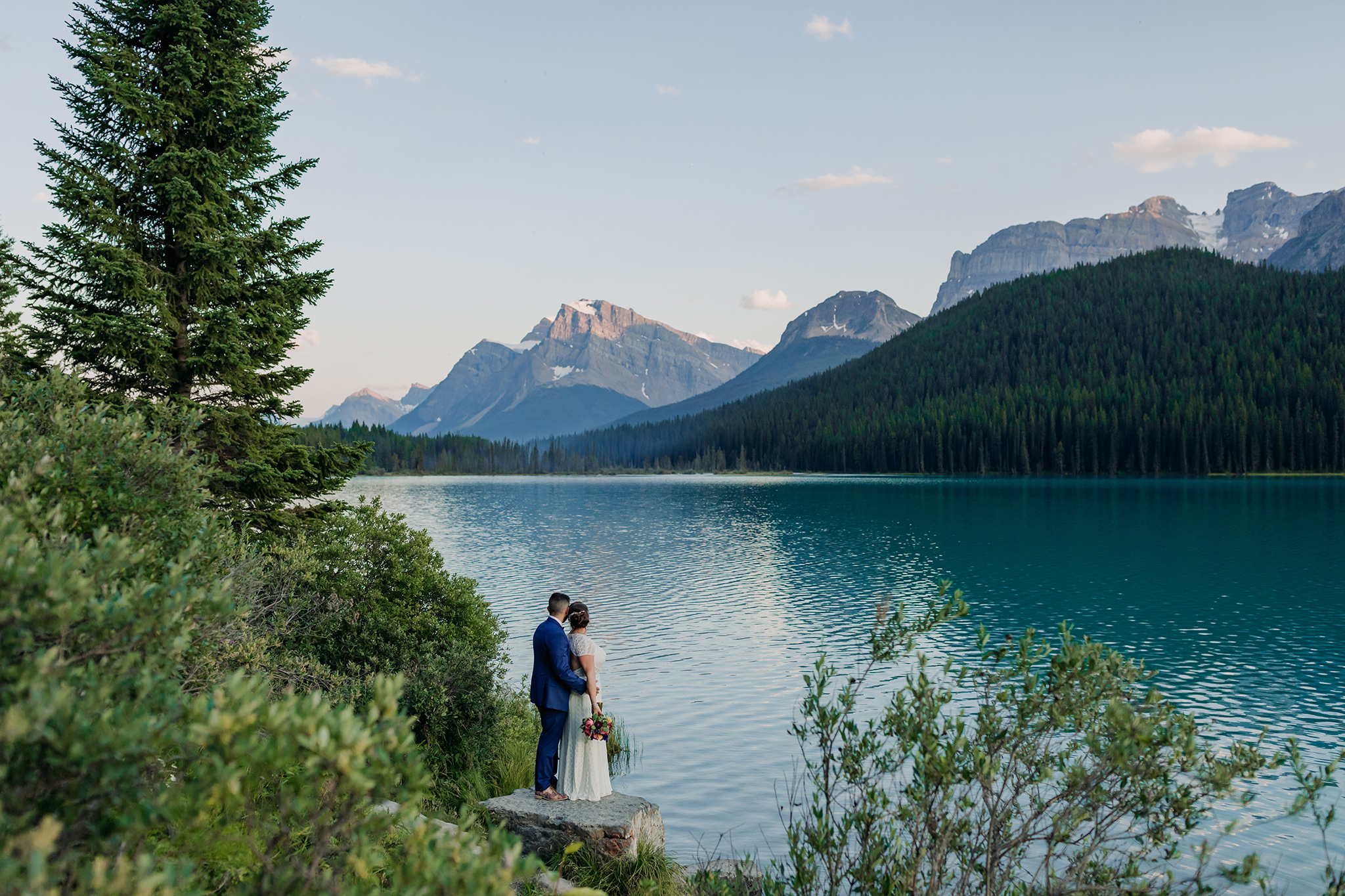 A Guide to Eloping in the Canadian Rockies | Mountain Wedding photographed by ENV Photography | sunset on wedding day at Waterfowl Lakes on Icefields Parkway