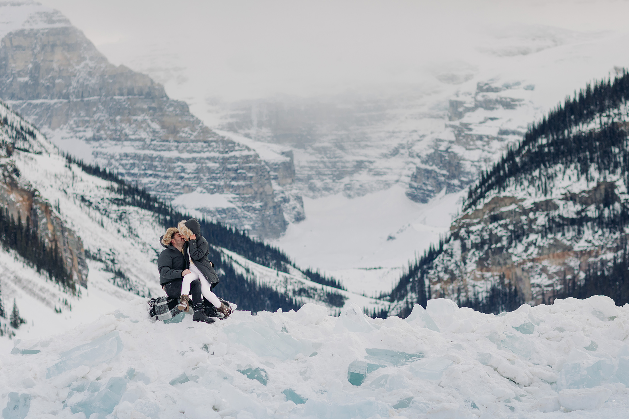 winter mountain vacation at Lake Louise Souvenir Vacation photos in the snow on the remains of the ice castle