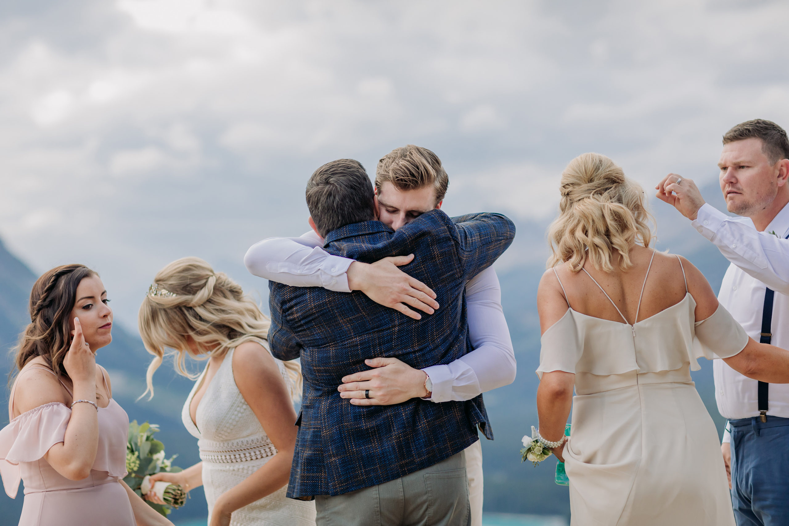 Peyto Lake Intimate wedding ceremony on Icefields Parkway surrounded by Mountains overlooking blue mountain Lake in the summer photographed my ENV Photography