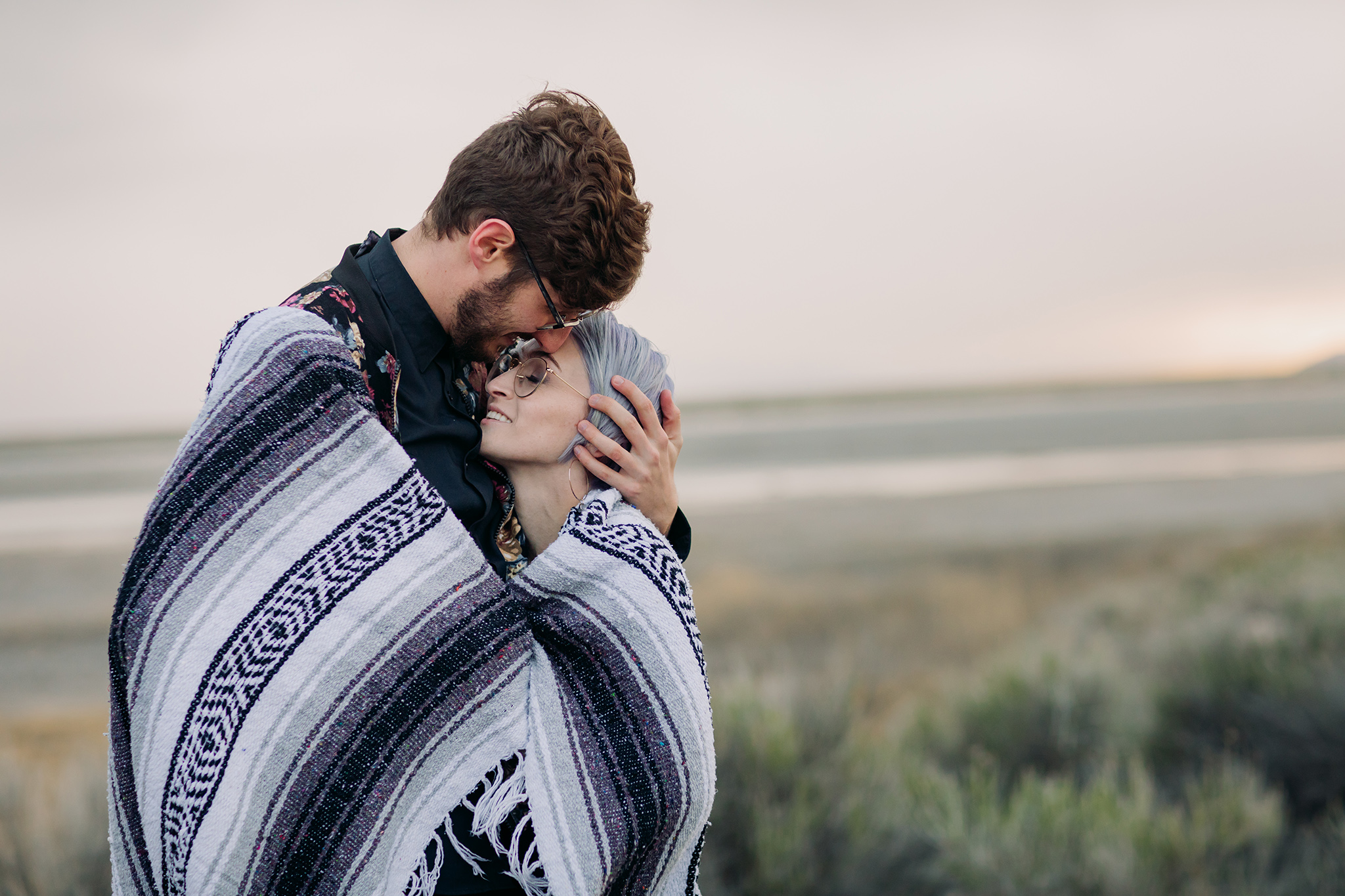 Great Saltair engagement couples photos on a stormy evening near Salt Lake City Utah Stylish couple with outfits inspiration for engagement photos by ENV Photography