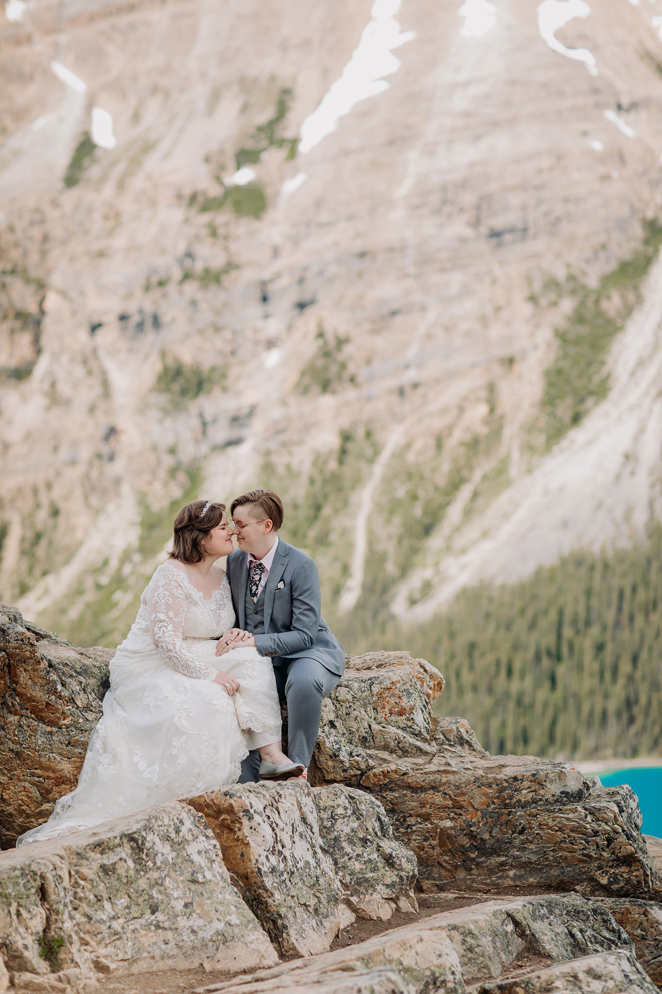Post-wedding portraits rocky viewpoint at Peyto Lake. same-sex wedding. Mountain Wedding portraits photographed by ENV Photography. Gay friendly. LGBTQ friendly wedding & elopement photographer.