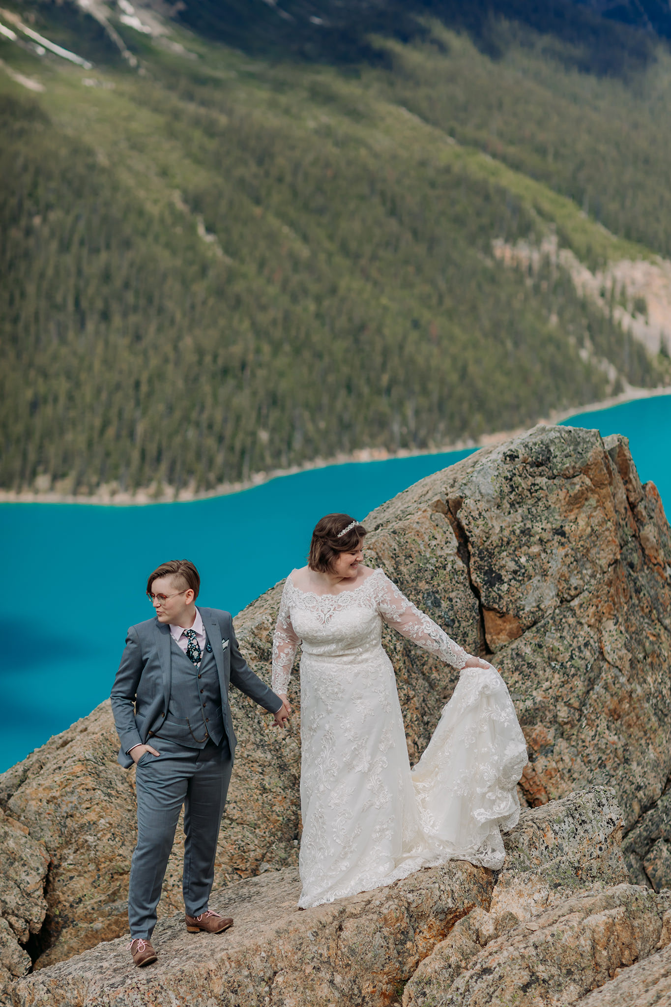 Icefields Parkway adventure session at rocky viewpoint at Peyto Lake with same-sex wedding. Mountain Wedding portraits photographed by ENV Photography. Gay friendly. LGBTQ friendly wedding & elopement photographer.