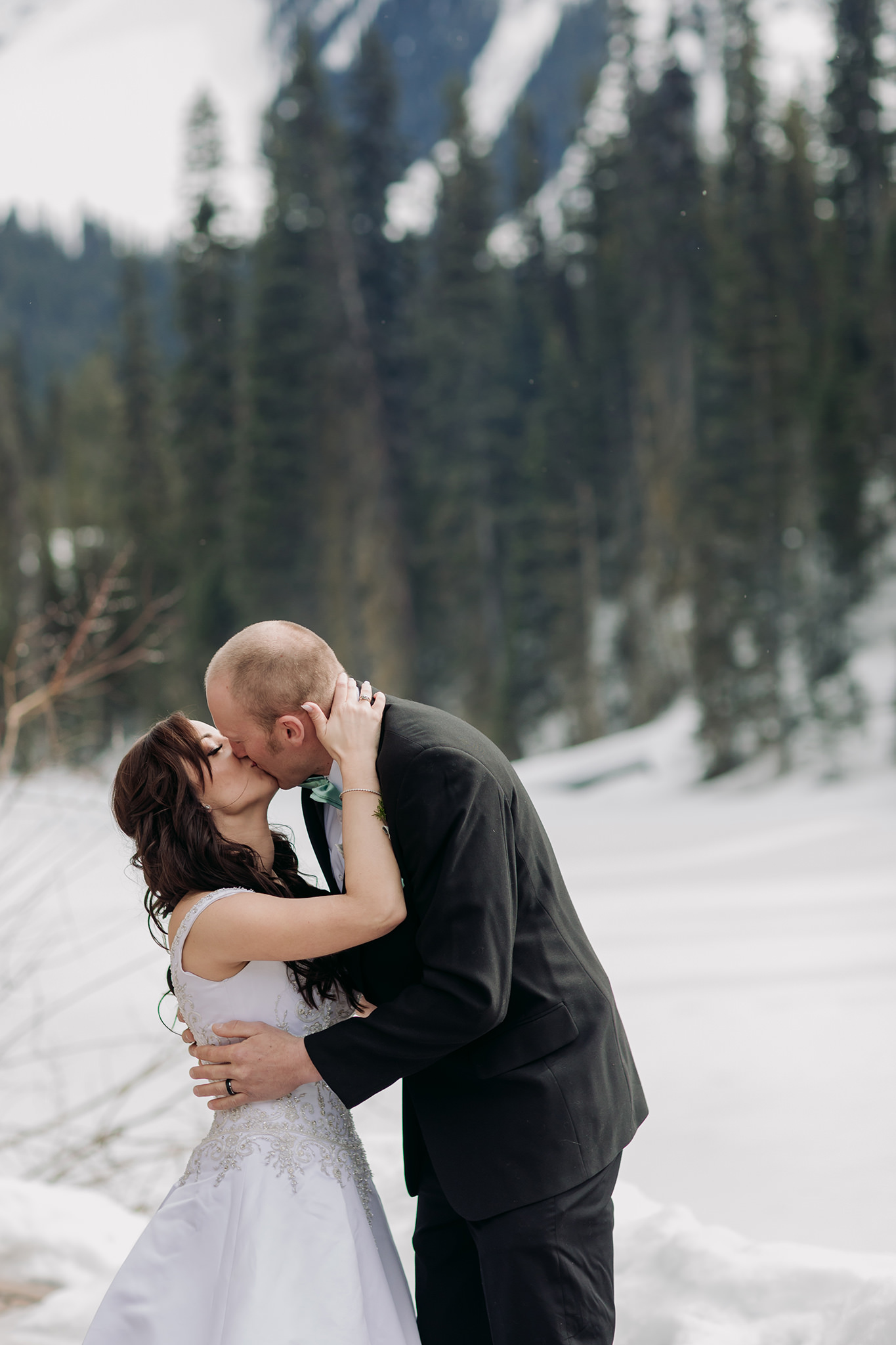 emerald lake lodge wedding spring mountain elopement ceremony on patio at Cilantro on the Lake with snow all around