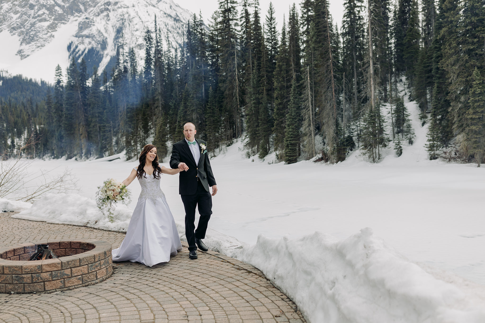 emerald lake lodge wedding spring mountain elopement ceremony on patio at Cilantro on the Lake with snow all around