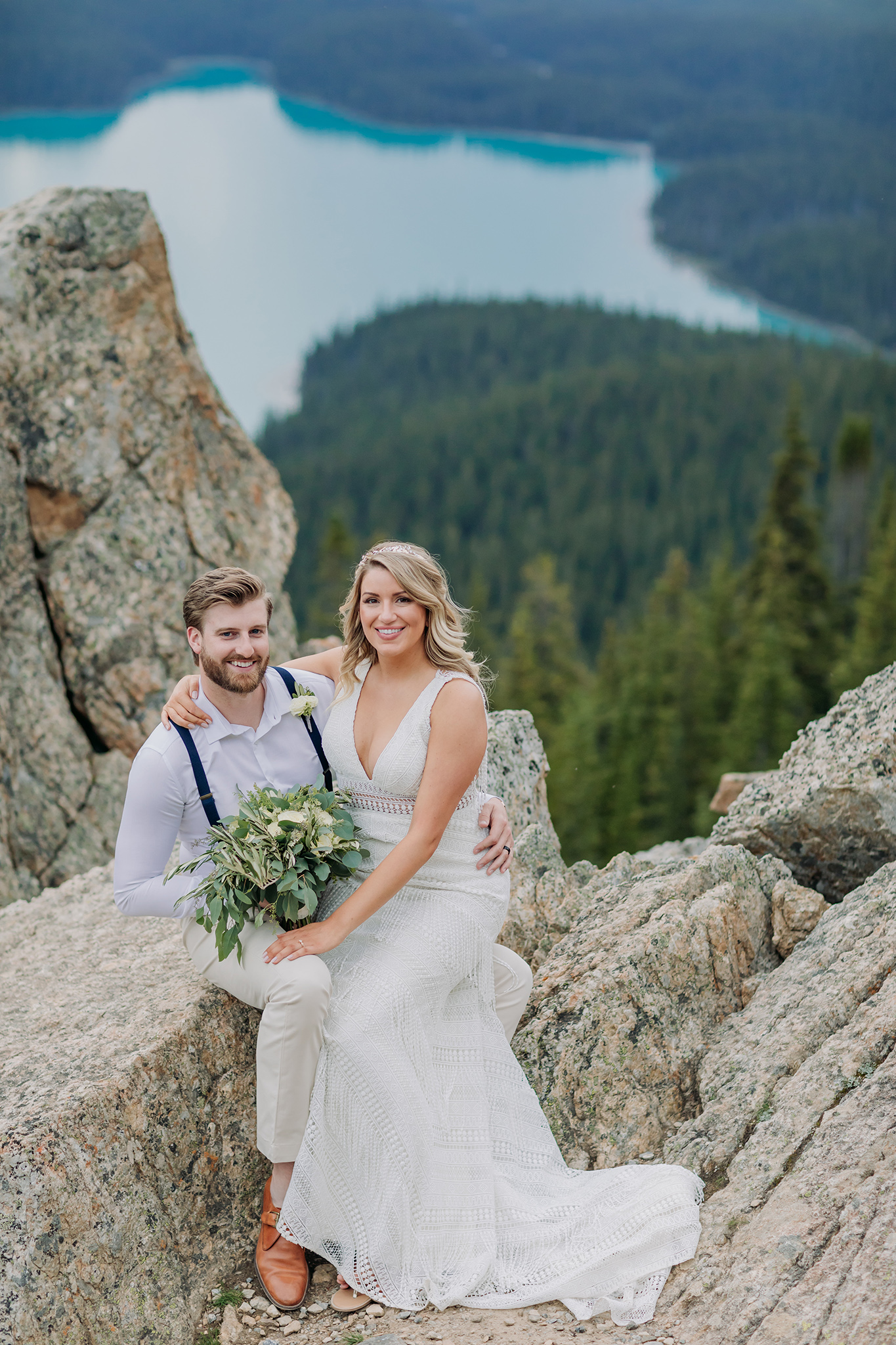 Peyto Lake Intimate wedding portraits on Icefields Parkway surrounded by Mountains overlooking blue mountain Lake in the summer photographed my ENV Photography