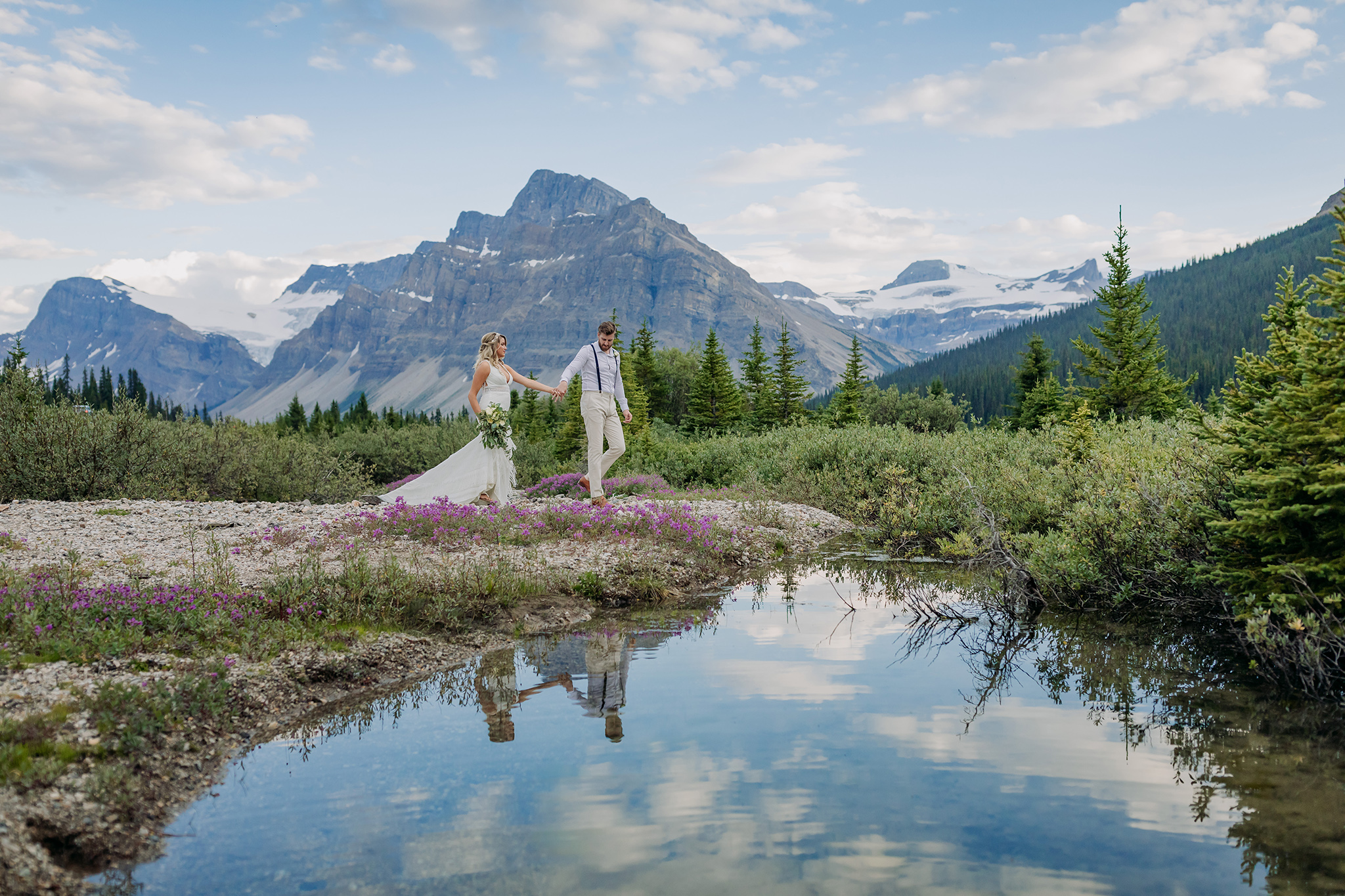 Icefields Parkway elopement in Summer with wildflowers, amazing reflection & epic mountain views all around photographed by ENV Photography