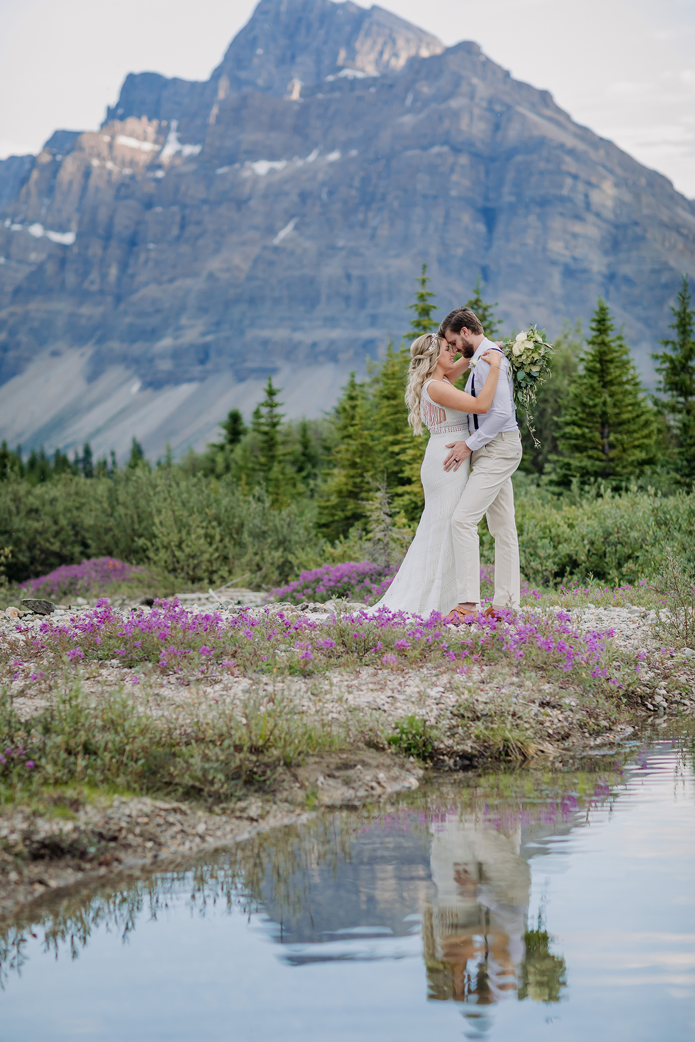 Icefields Parkway elopement in Summer with wildflowers, amazing reflection & epic mountain views all around photographed by ENV Photography