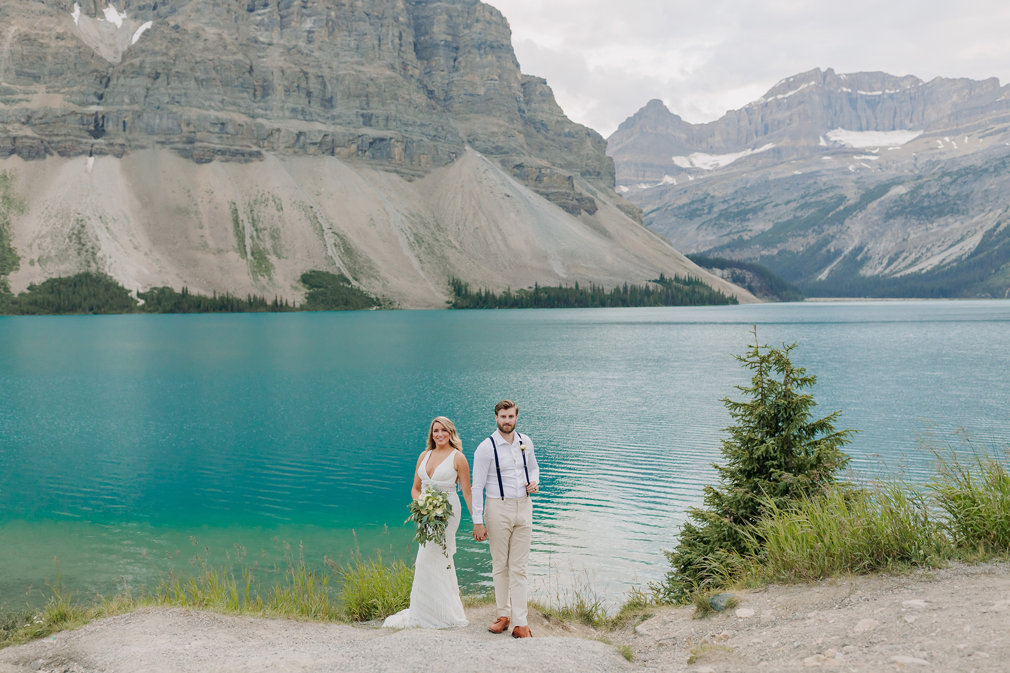 Icefields Parkway elopement in Summer with wildflowers & epic mountain views all around photographed by ENV Photography at bow lake