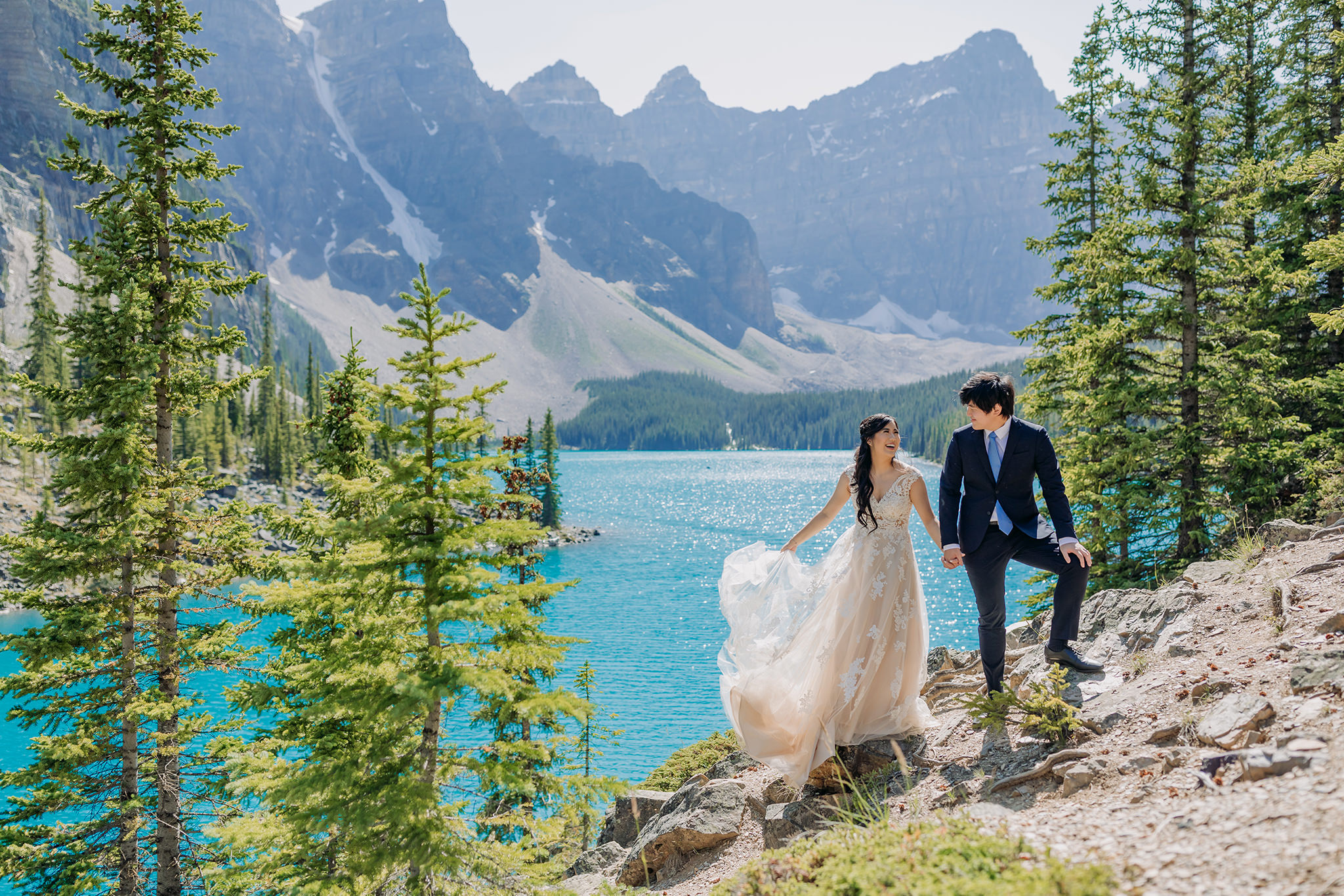 bride groom portraits at Moraine Lake on bright sunny day in Banff National Park photographed by mountain elopement specialist ENV Photography