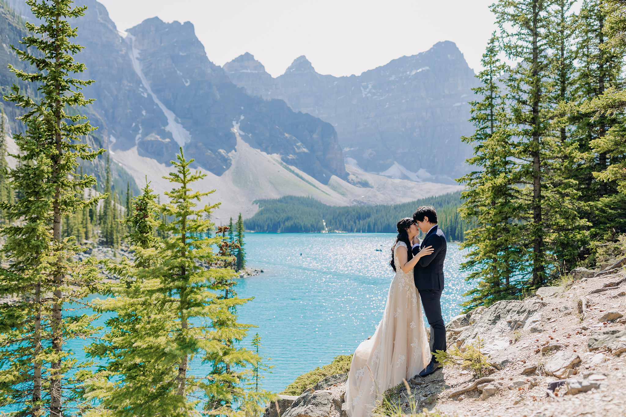 bride groom portraits at Moraine Lake on bright sunny day in Banff National Park photographed by mountain elopement specialist ENV Photography