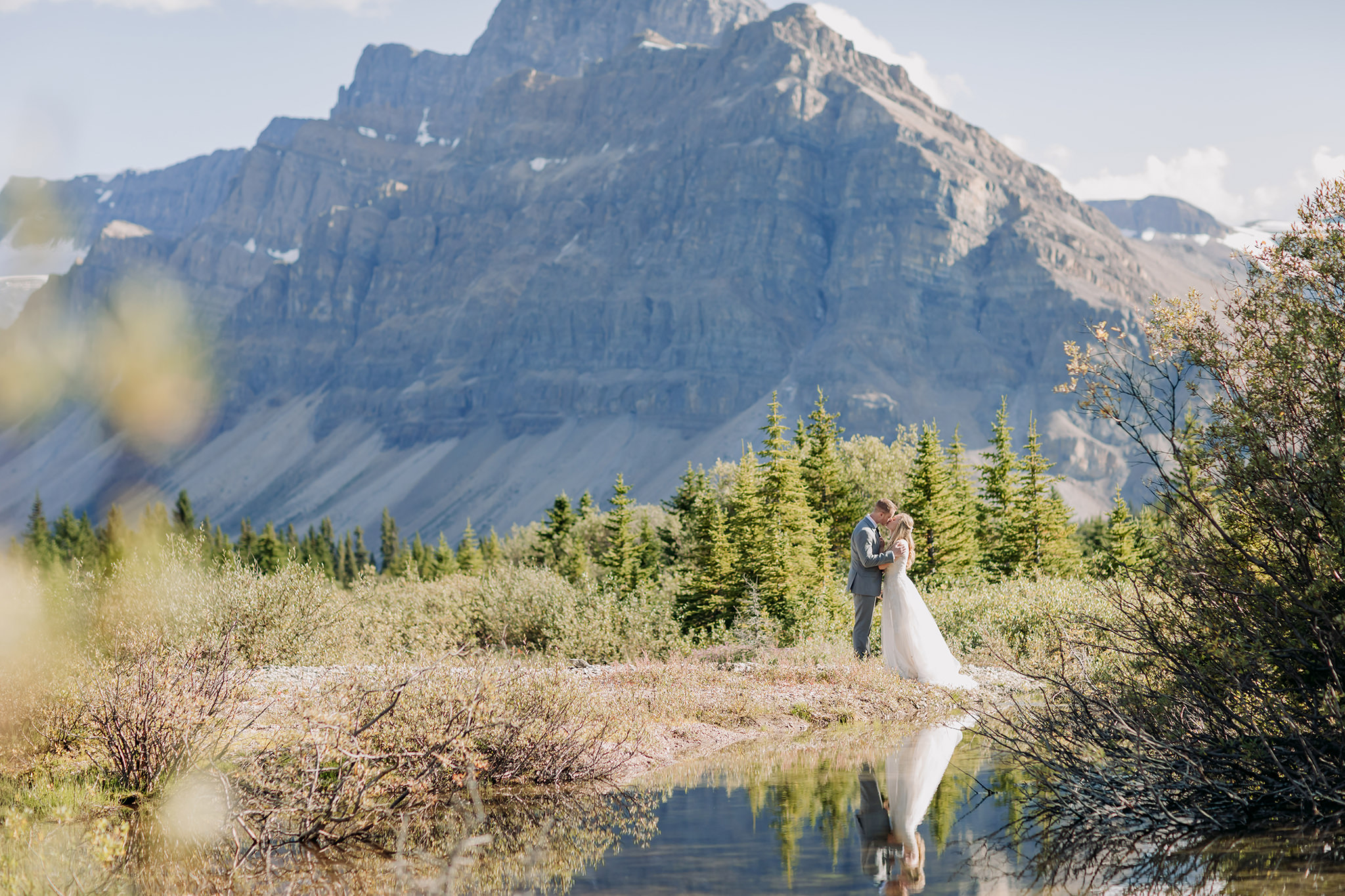 Exploring Icefields Parkway in Banff National Park on their wedding day. Summer mountain elopement off the beaten path photographed by local wedding & elopement photographer ENV Photography 