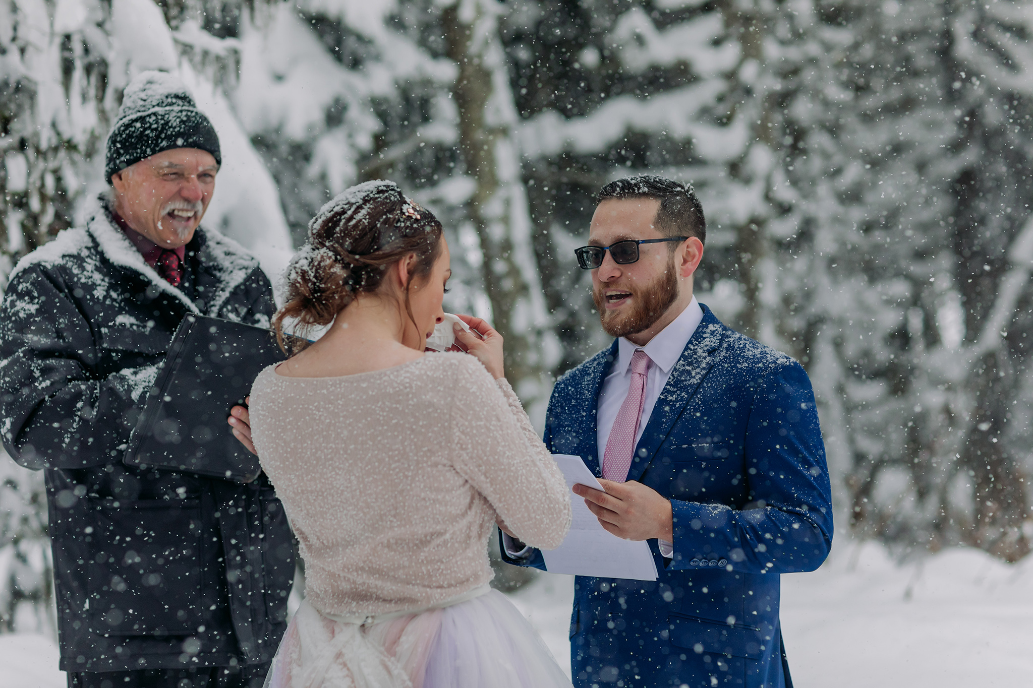 Elope in Lake Louise with a magical snowy outdoor winter wonderland forest wedding ceremony