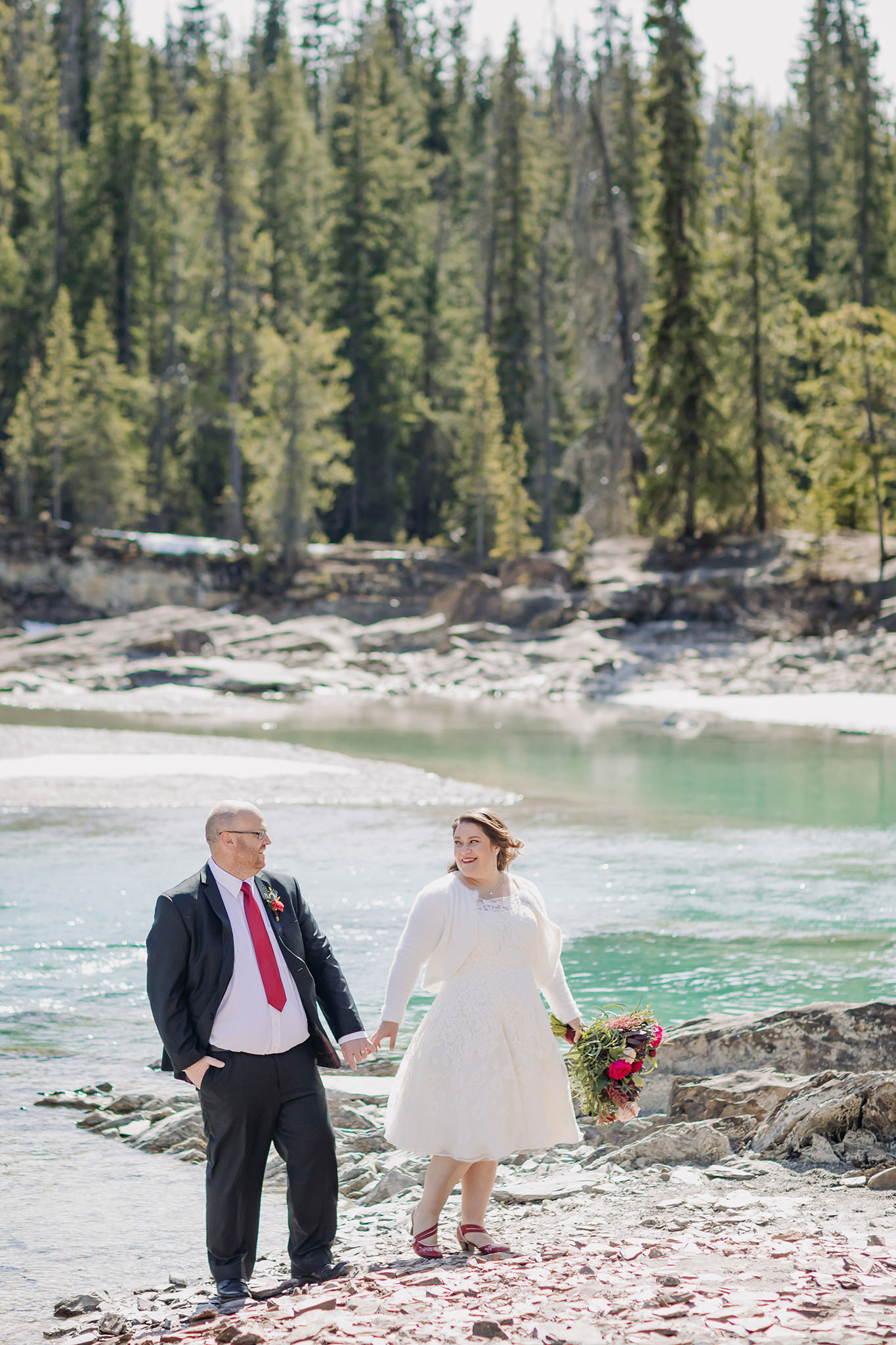 Emerald Lake Lodge intimate bride & groom portraits at the nearby Natural Bridge in Yoho National Park in late April