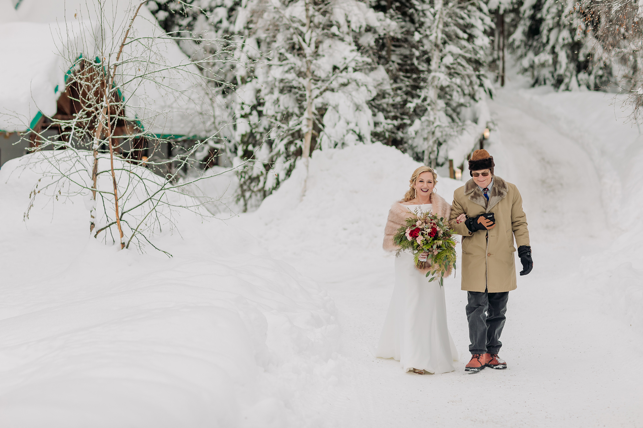 Emerald Lake Lodge outdoor winter wedding ceremony in a real life snow globe photographed by mountain elopement photographer ENV Photography
