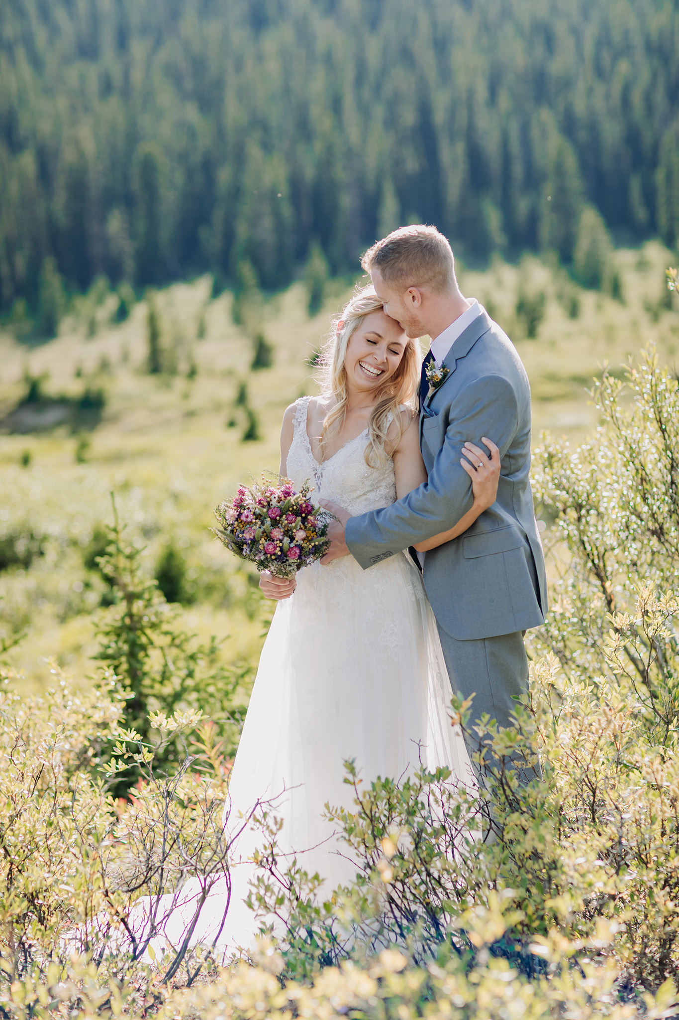 Exploring Icefields Parkway in Banff National Park on their wedding day. Summer mountain elopement off the beaten path photographed by local wedding & elopement photographer ENV Photography 