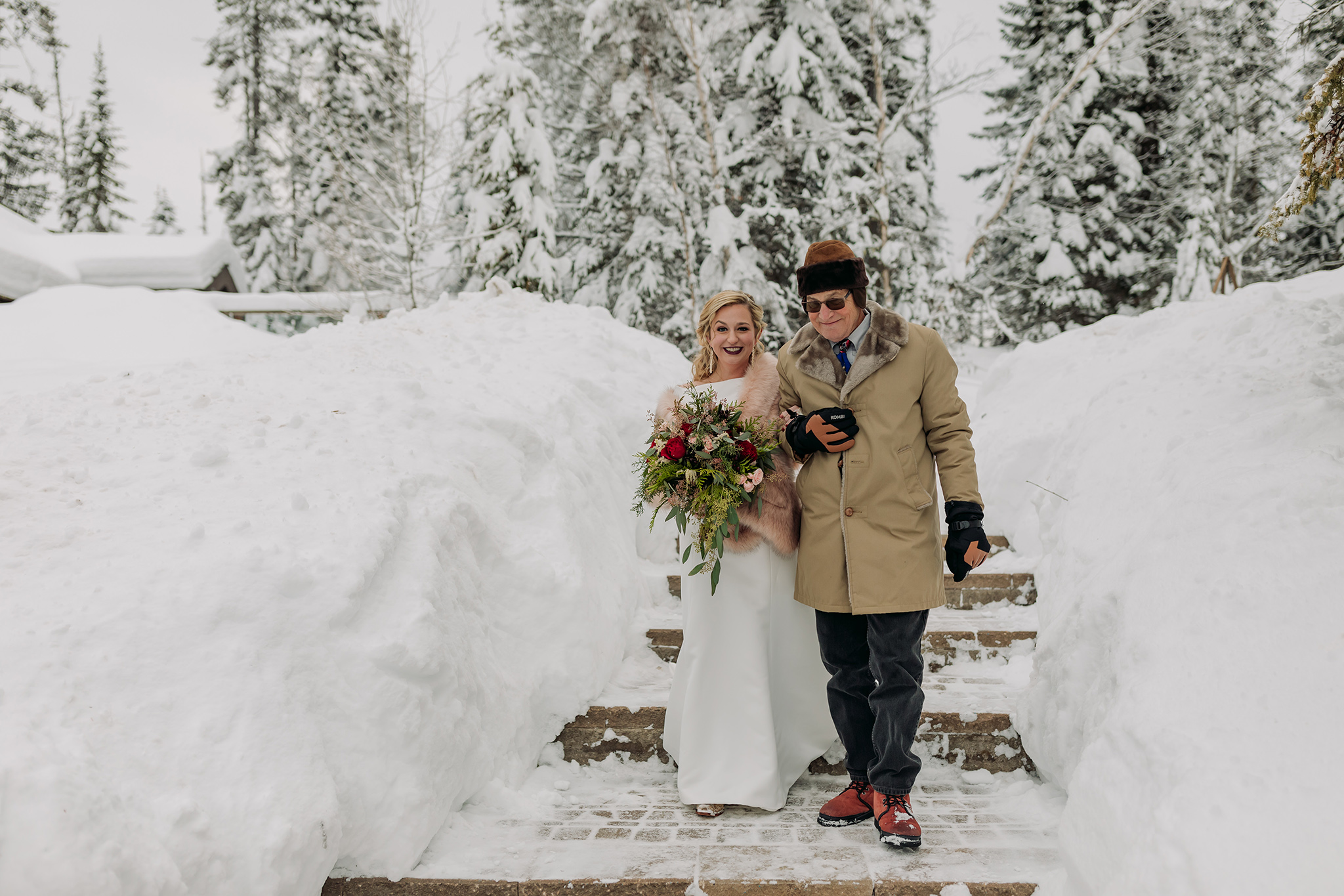 Emerald Lake Lodge outdoor winter wedding ceremony in a real life snow globe photographed by mountain elopement photographer ENV Photography