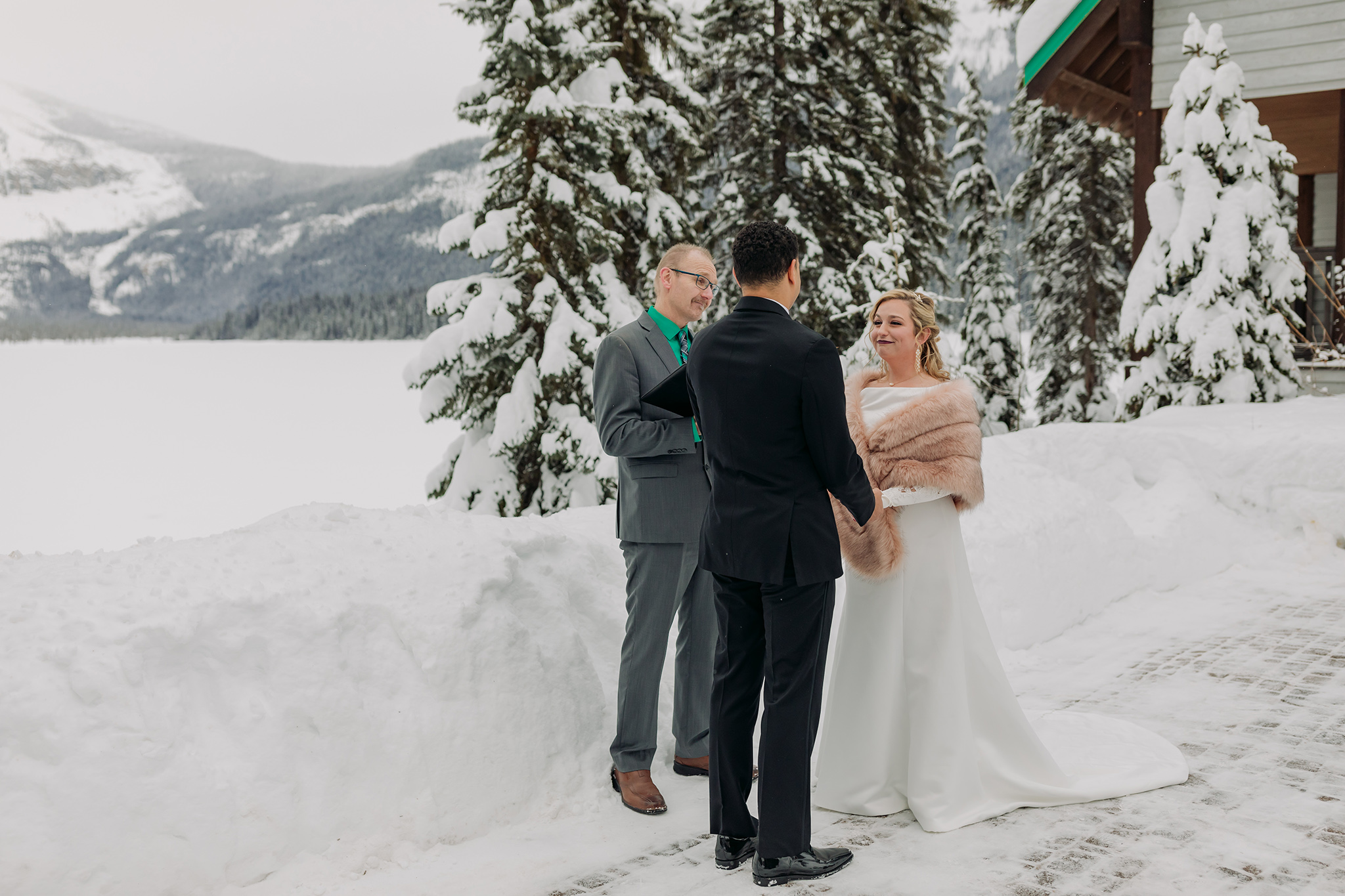 Emerald Lake Lodge outdoor winter wedding ceremony in a real life snowglobe photographed by mountain elopement photographer ENV Photography