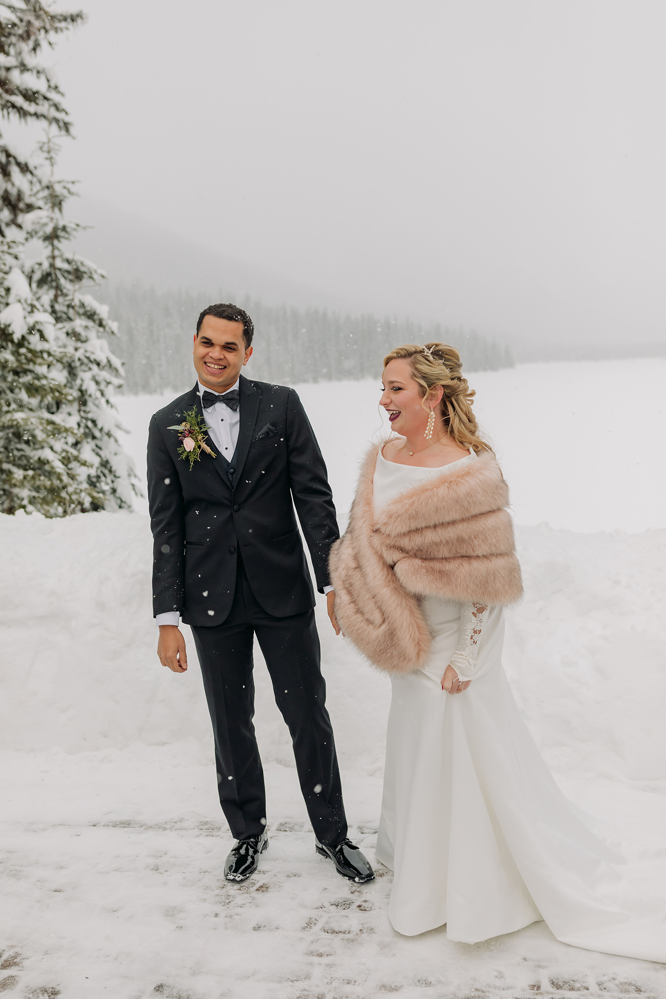Emerald Lake Lodge outdoor winter wedding ceremony in a real life snowglobe photographed by mountain elopement photographer ENV Photography