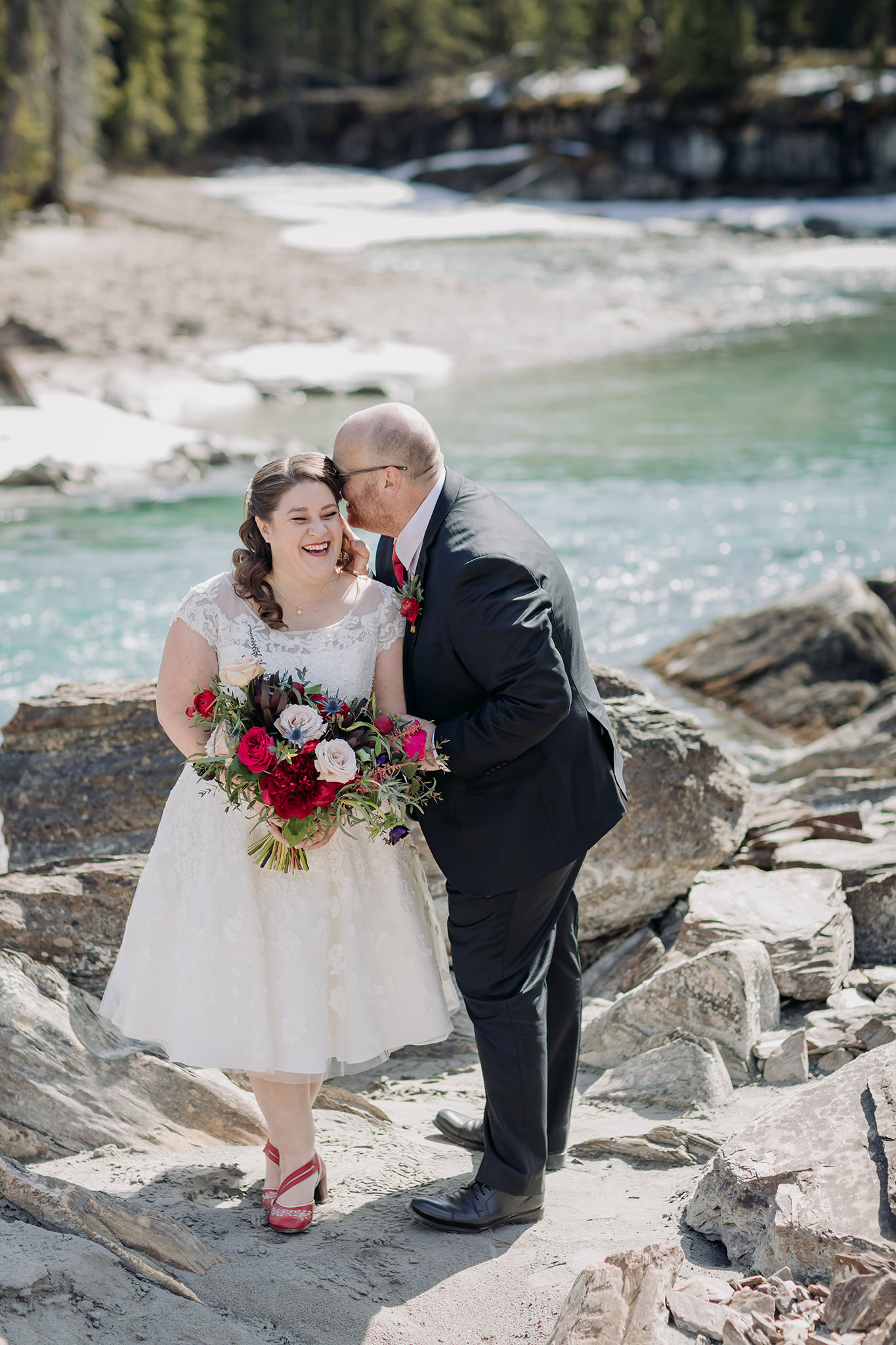 Emerald Lake Lodge intimate bride & groom portraits at the nearby Natural Bridge in Yoho National Park in late April